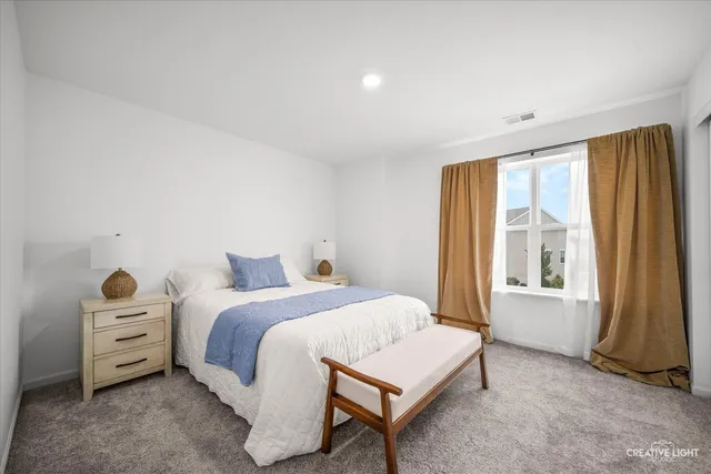 a bathroom with a double vanity sink toilet and shower