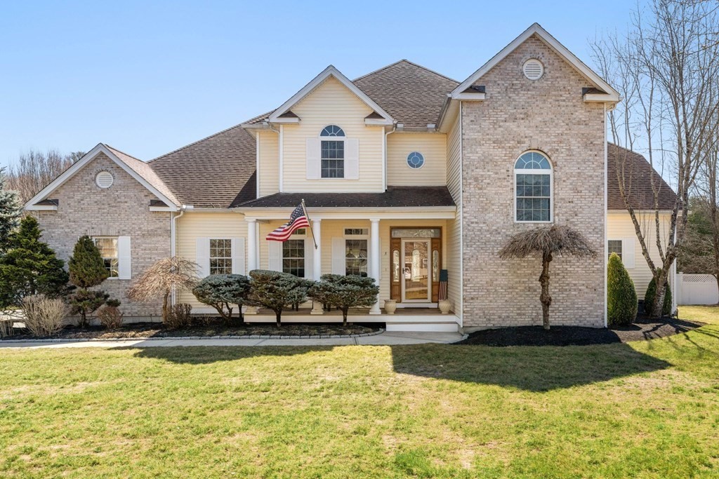 a front view of a house with a yard