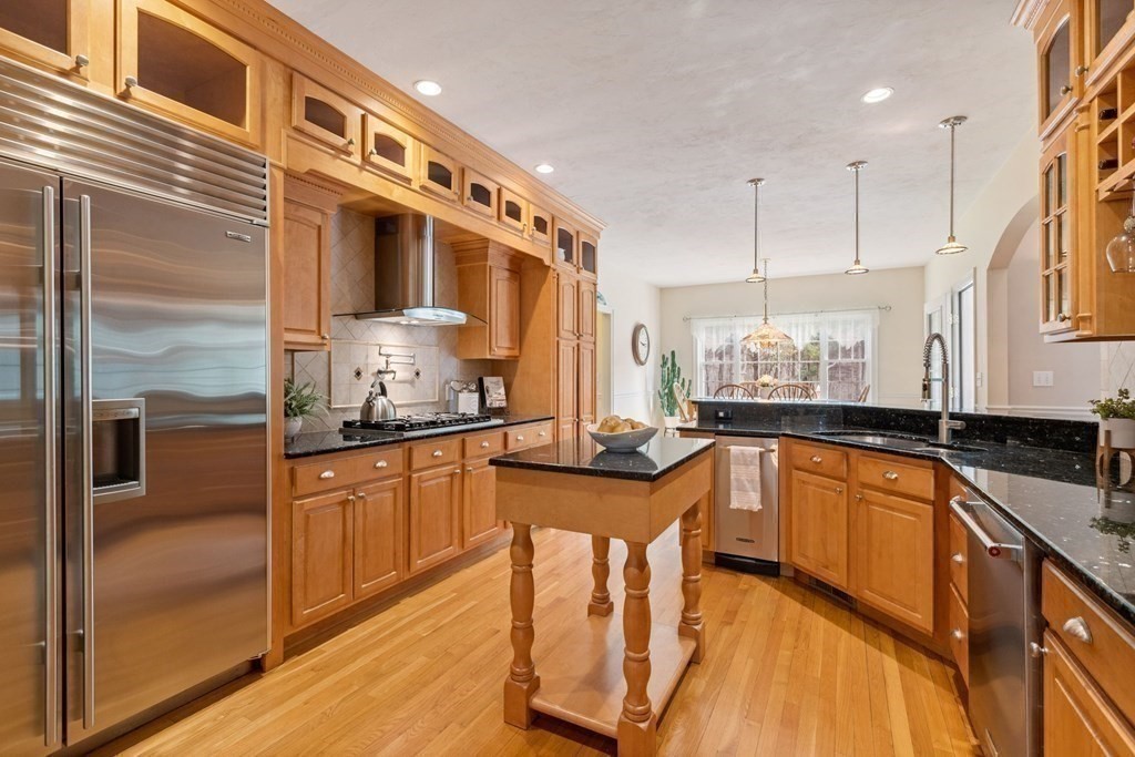 5 Rolling Meadow Drive Millis, MA 02054 - Photo 12 of 42 a kitchen with granite countertop a sink and cabinets