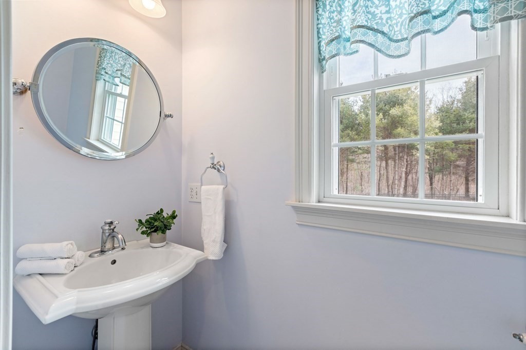 5 Rolling Meadow Drive Millis, MA 02054 - Photo 15 of 42 a bathroom with a sink and a mirror