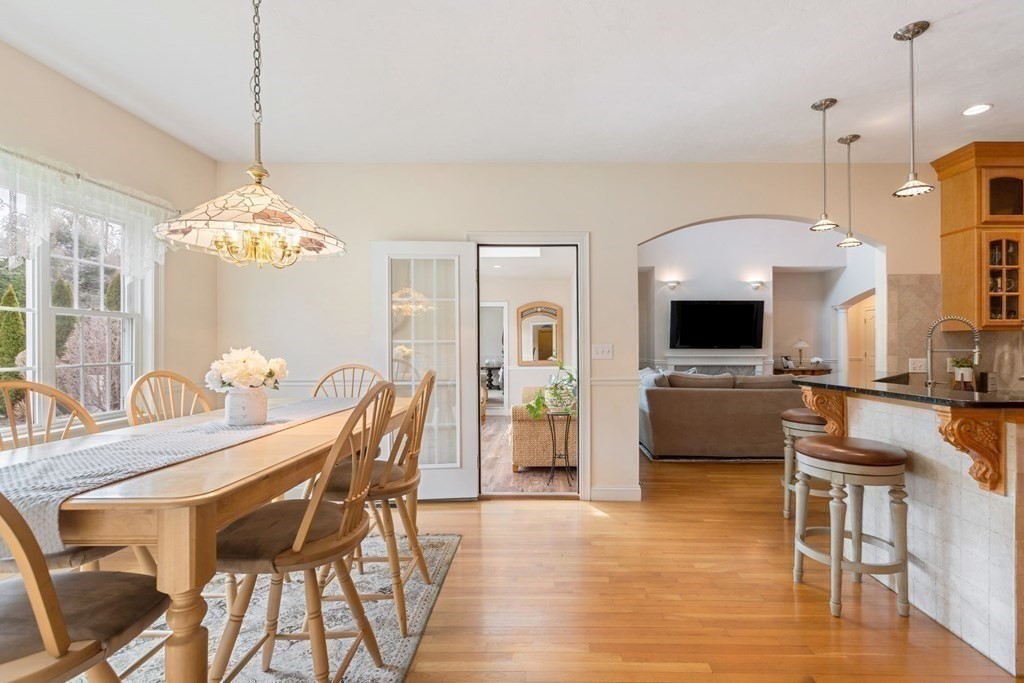 5 Rolling Meadow Drive Millis, MA 02054 - Photo 18 of 42 a view of a dining room with furniture and a chandelier