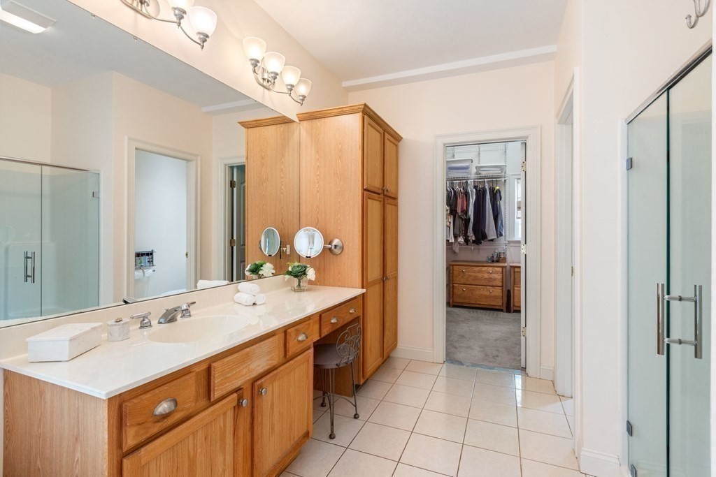 5 Rolling Meadow Drive Millis, MA 02054 - Photo 24 of 42 a spacious bathroom with a sink double vanity and a mirror