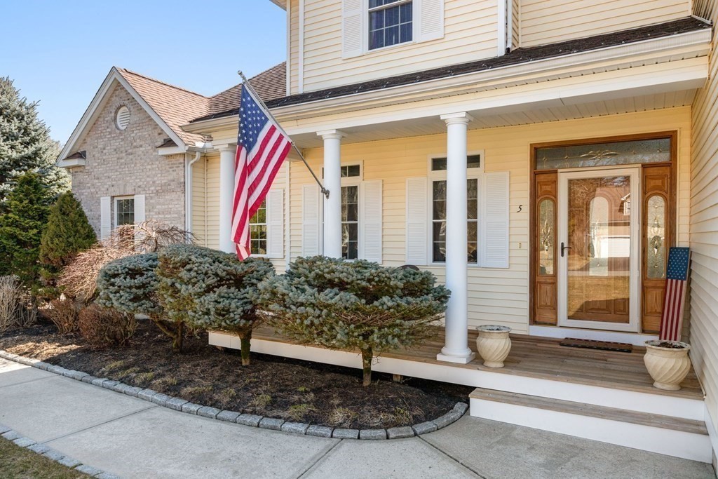 5 Rolling Meadow Drive Millis, MA 02054 - Photo 3 of 42 a front view of a house with a yard