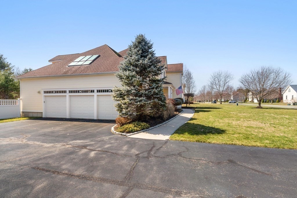 5 Rolling Meadow Drive Millis, MA 02054 - Photo 5 of 42 a view of a house with a yard and garage