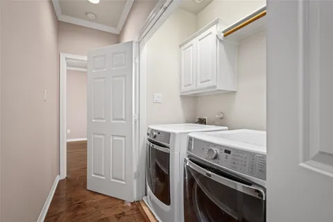 a bathroom with a double vanity sink toilet mirror and bathtub