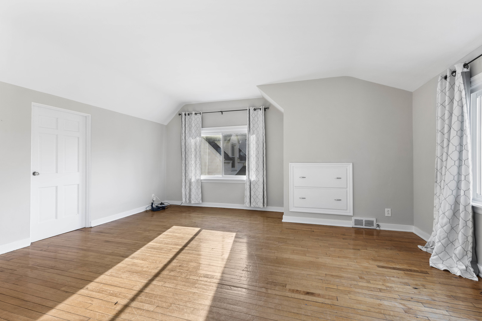 1082 North 8th Street Rochelle, IL 61068 - Photo 11 of 22 a view of empty room with wooden floor and fan