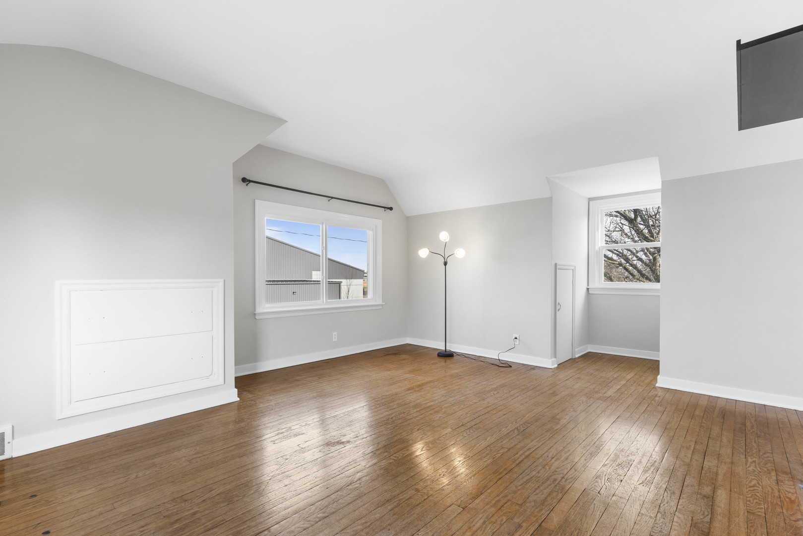 1082 North 8th Street Rochelle, IL 61068 - Photo 13 of 22 an empty room with wooden floor and windows