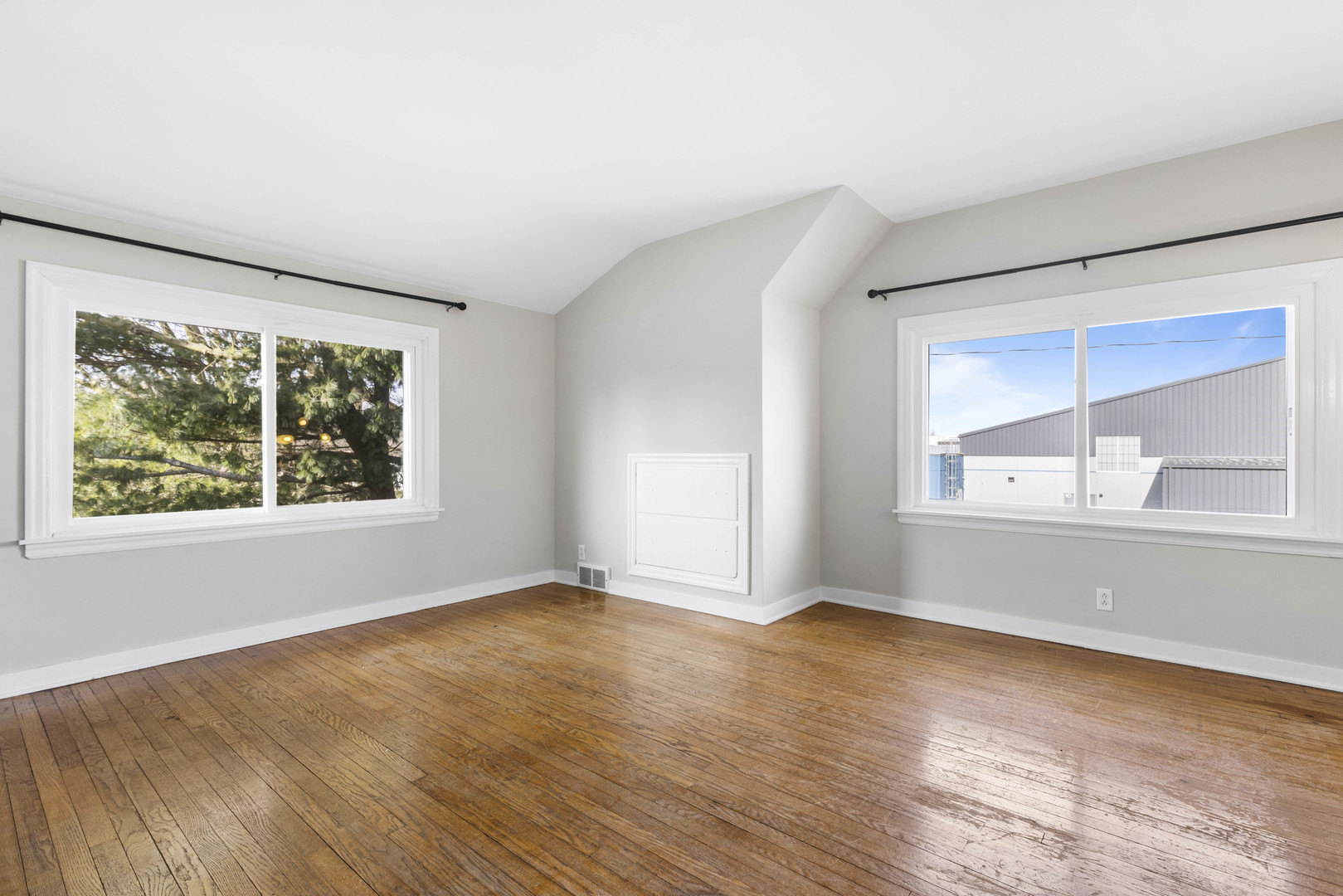 1082 North 8th Street Rochelle, IL 61068 - Photo 14 of 22 an empty room with wooden floor and windows