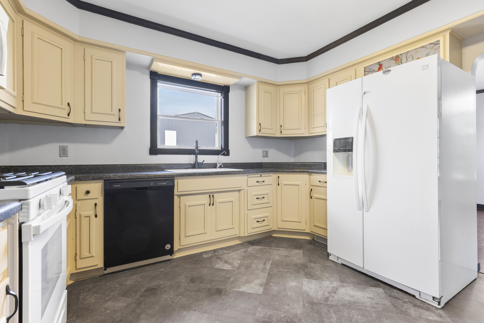 1082 North 8th Street Rochelle, IL 61068 - Photo 5 of 22 a kitchen with granite countertop white cabinets and white appliances