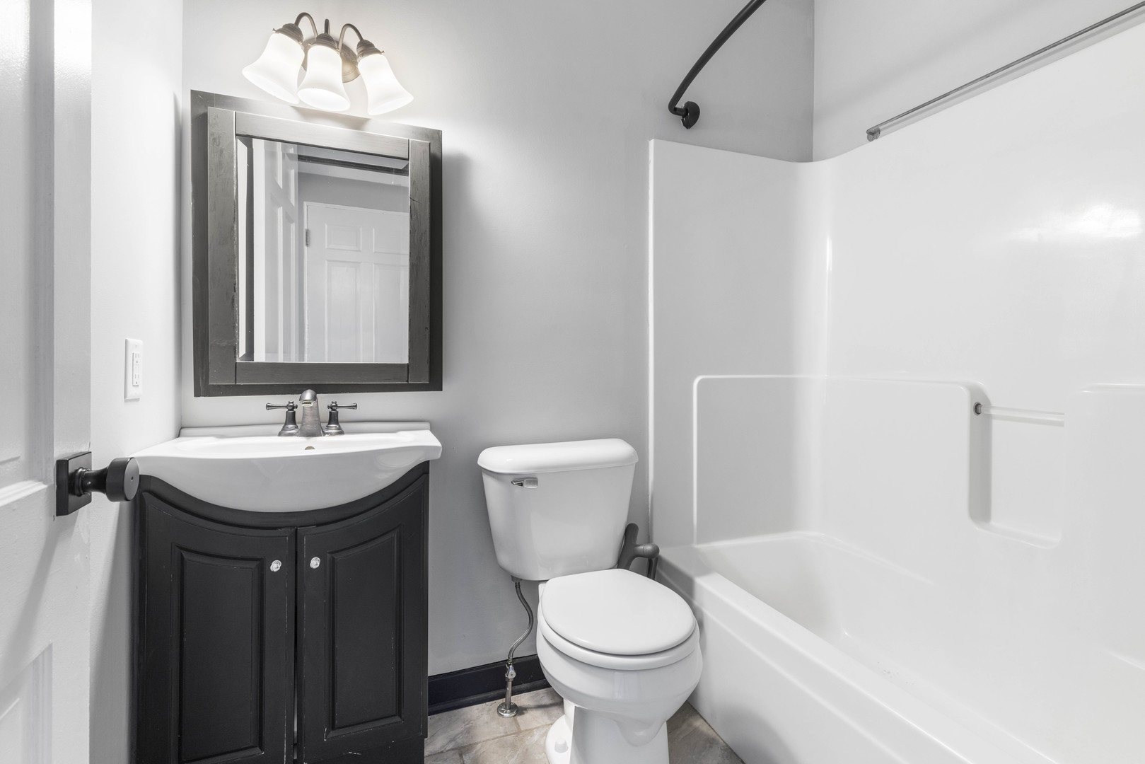 1082 North 8th Street Rochelle, IL 61068 - Photo 8 of 22 a bathroom with a sink a toilet and shower