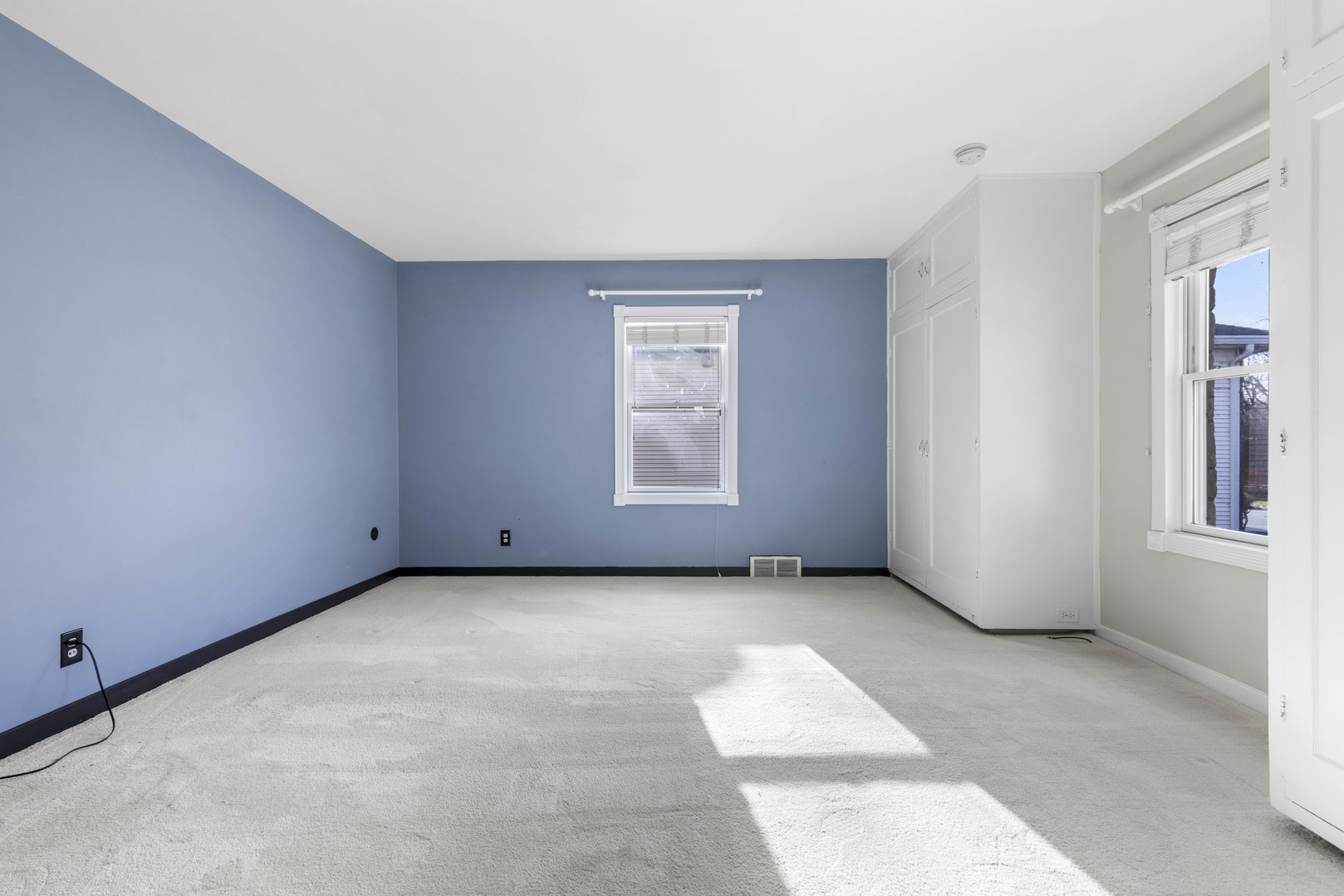 1082 North 8th Street Rochelle, IL 61068 - Photo 9 of 22 a view of a livingroom with an empty space and a window