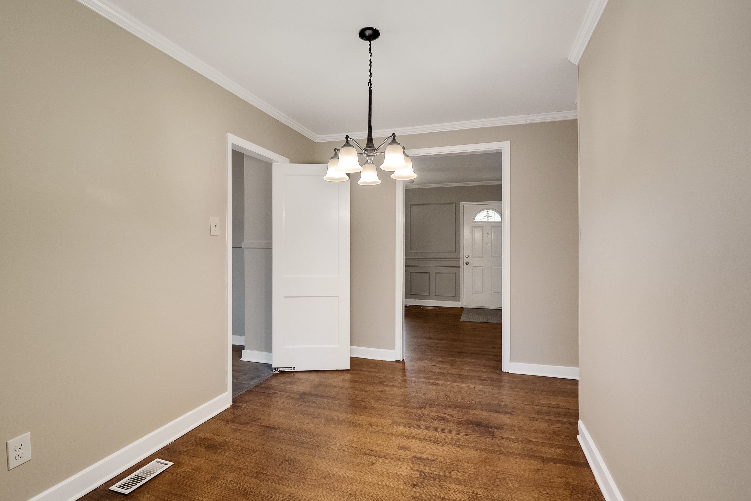 4329 Jamerson Road Memphis, TN 38122 - Photo 11 of 33 a view of a hallway with wooden floor and chandelier