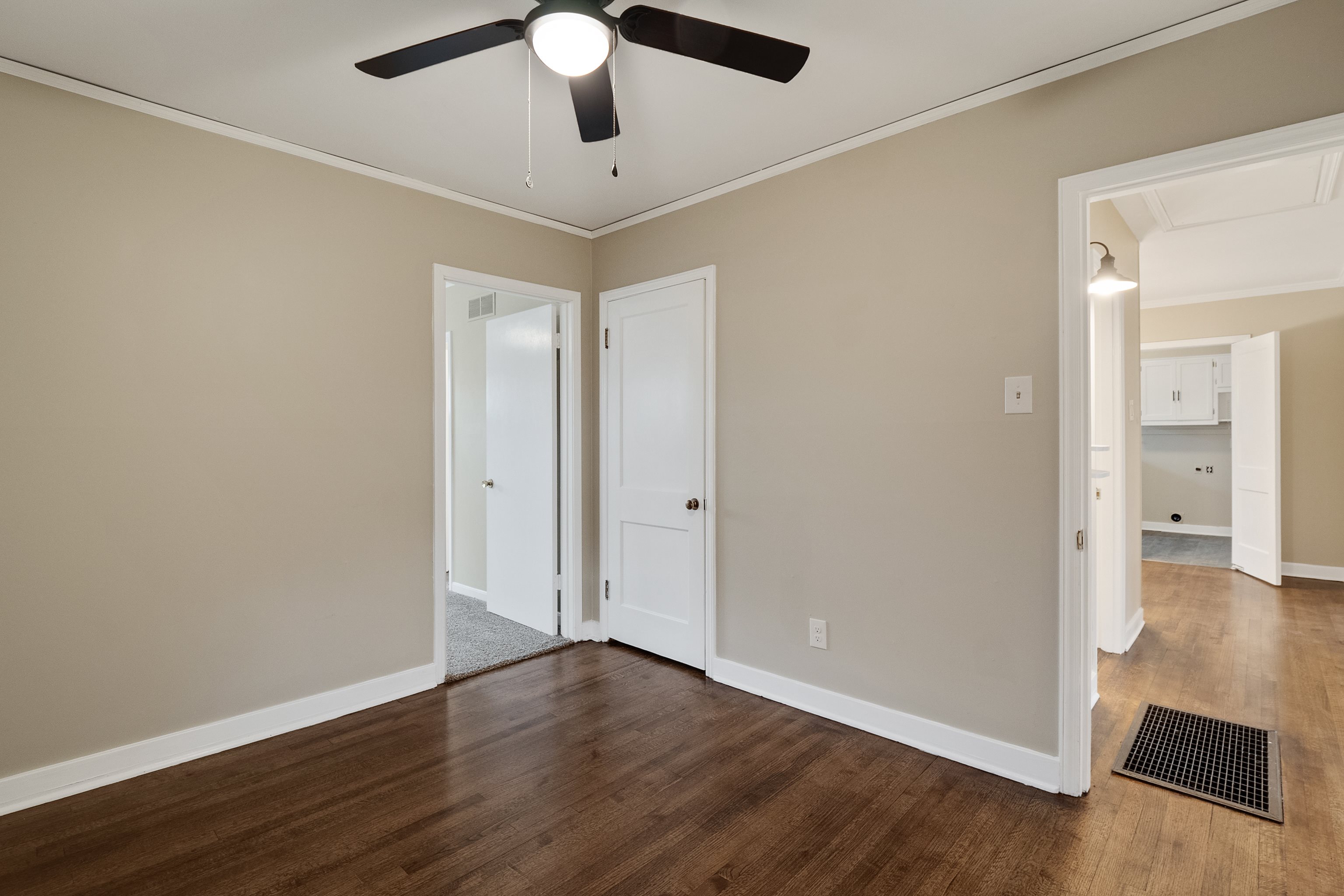 4329 Jamerson Road Memphis, TN 38122 - Photo 12 of 33 an empty room with wooden floor and windows