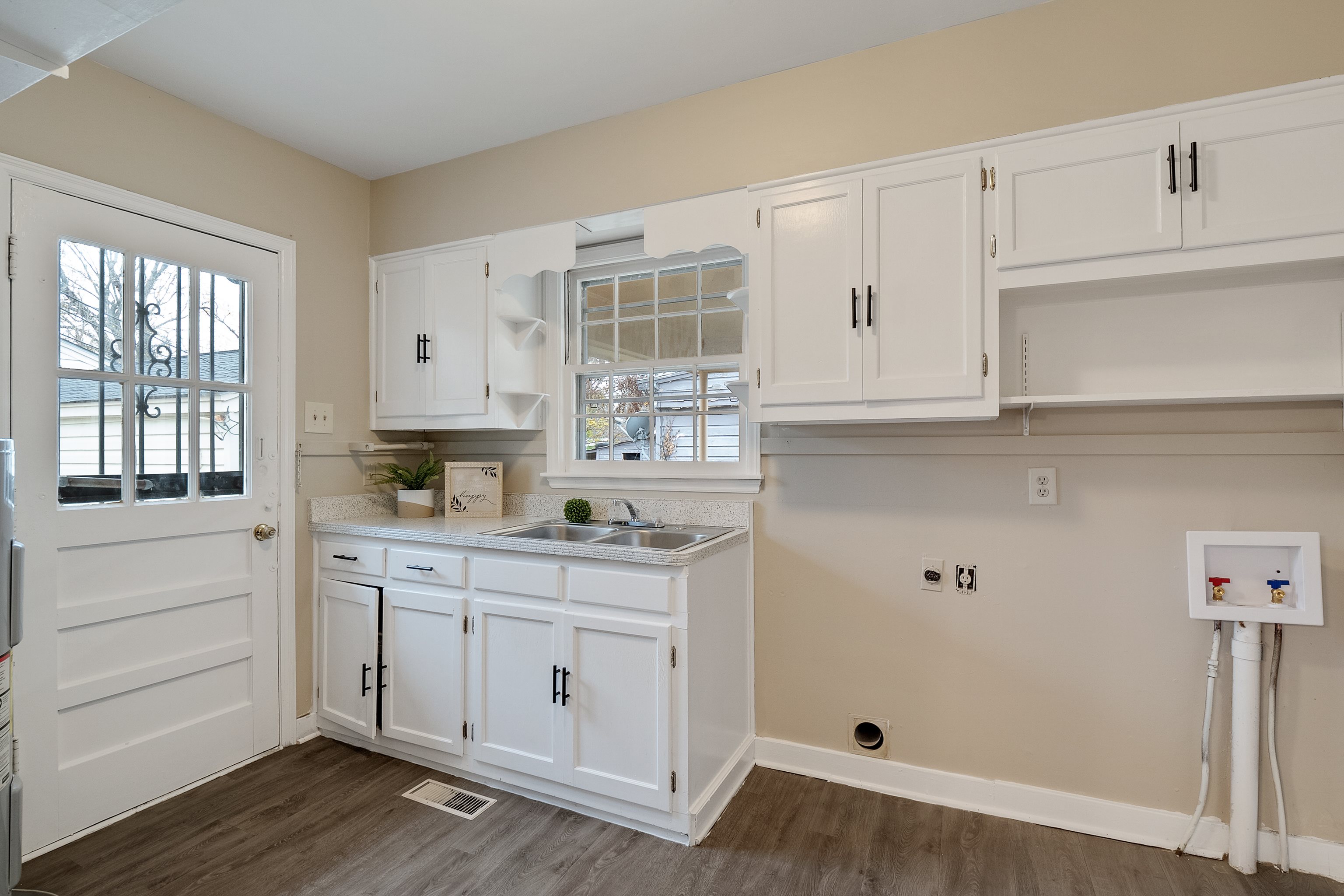 4329 Jamerson Road Memphis, TN 38122 - Photo 15 of 33 a kitchen with granite countertop white cabinets and white appliances