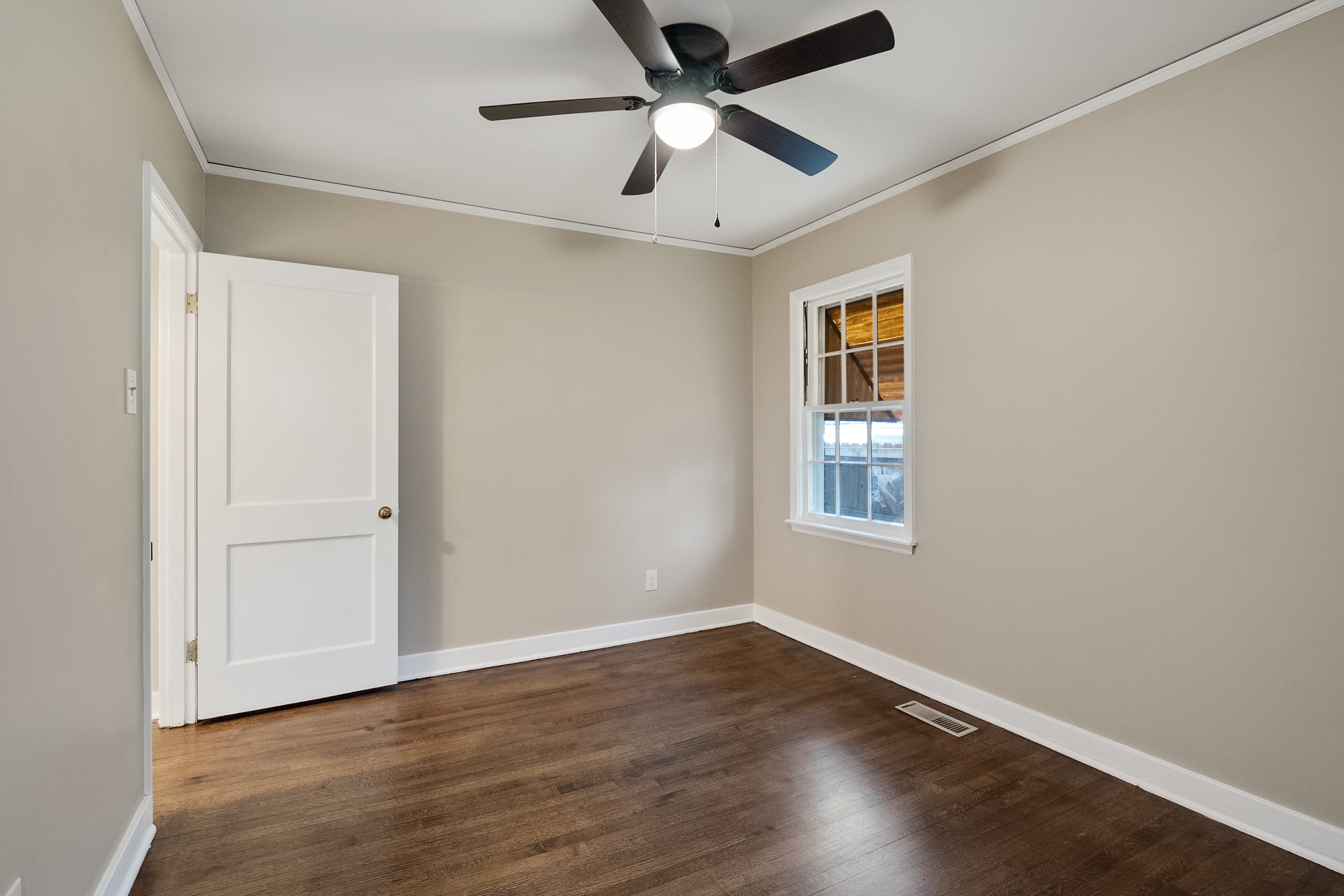 4329 Jamerson Road Memphis, TN 38122 - Photo 17 of 33 a view of empty room with wooden floor and fan