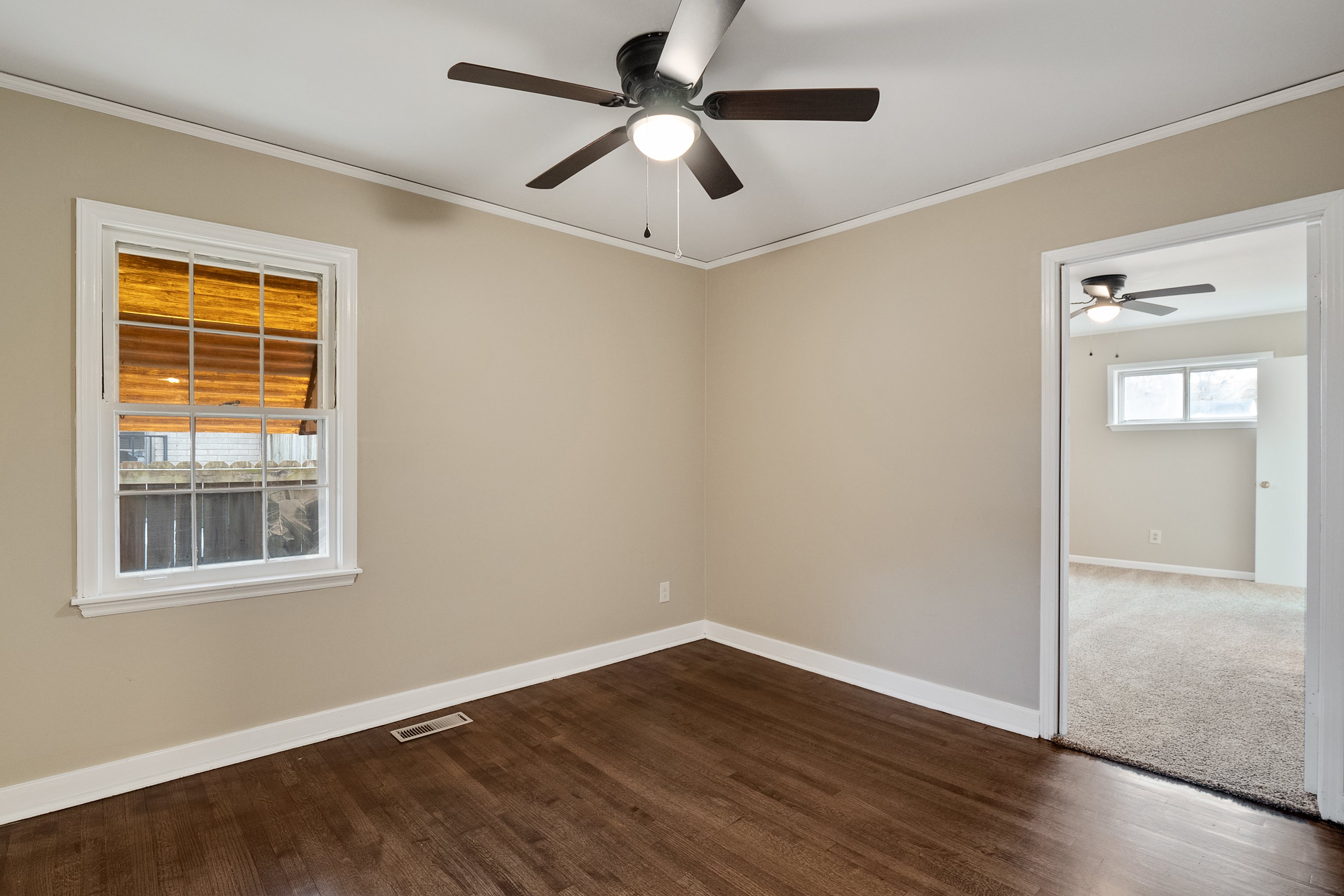 4329 Jamerson Road Memphis, TN 38122 - Photo 18 of 33 a view of empty room with wooden floor and fan