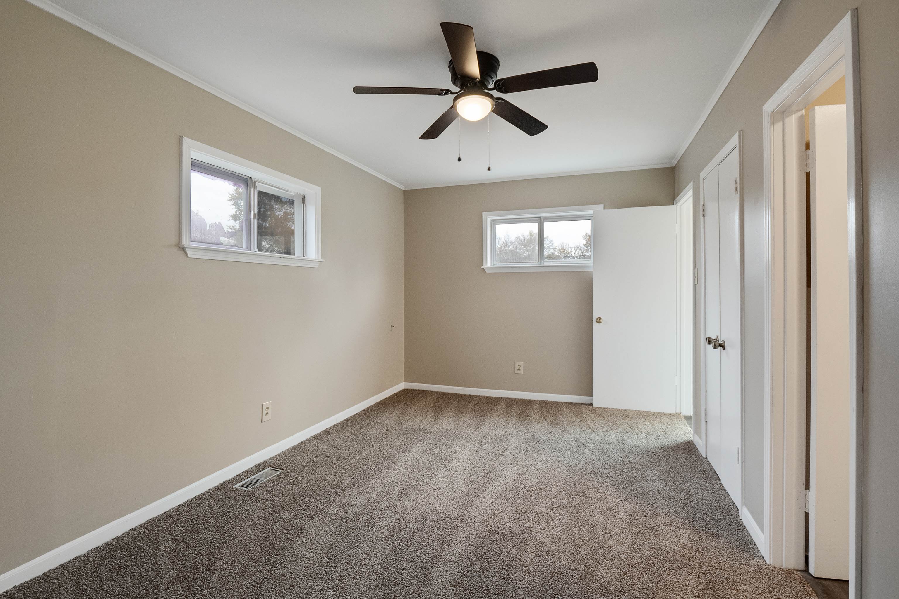 4329 Jamerson Road Memphis, TN 38122 - Photo 21 of 33 a view of a big room with wooden floor and windows