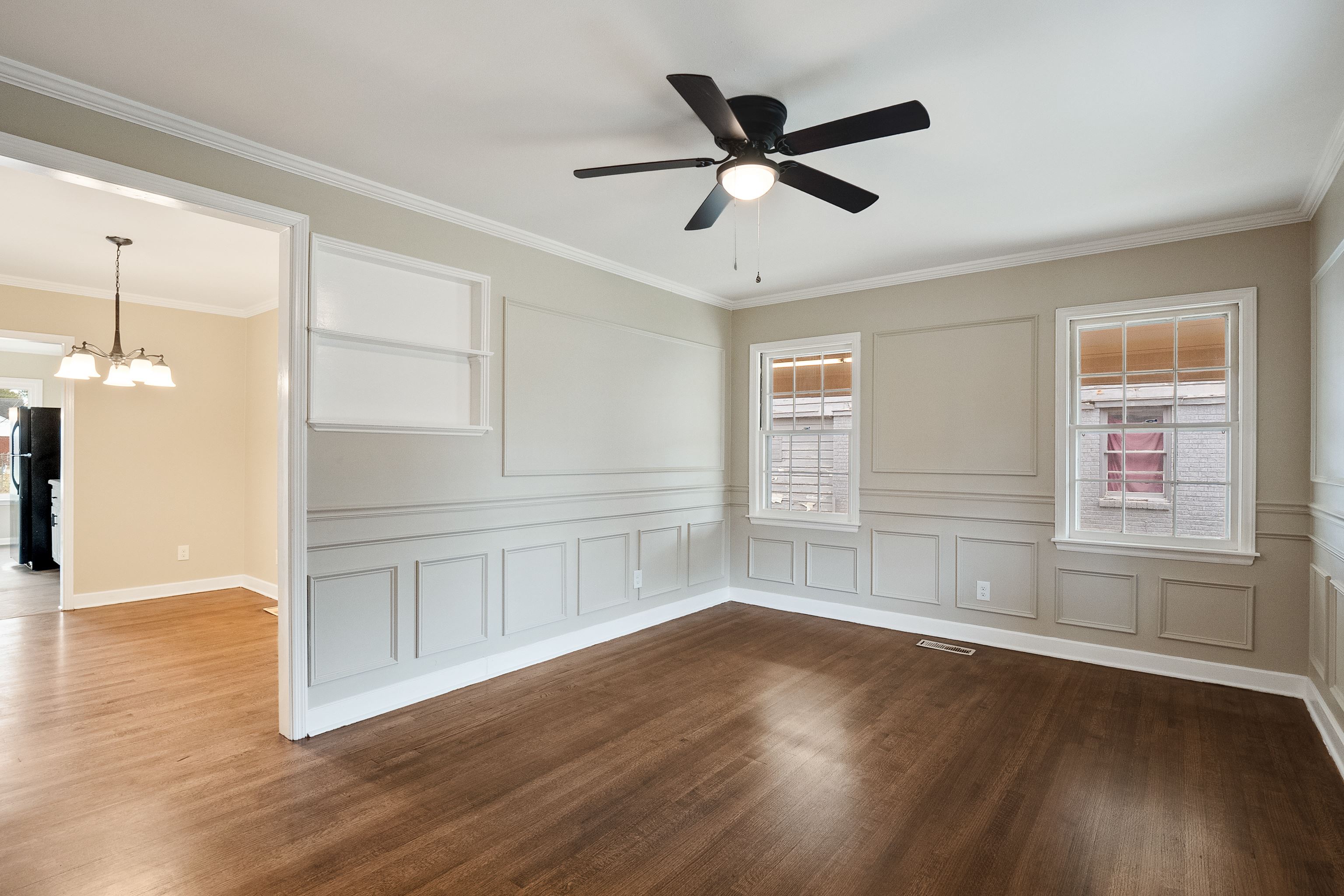 4329 Jamerson Road Memphis, TN 38122 - Photo 3 of 33 a view of an empty room with wooden floor and a window