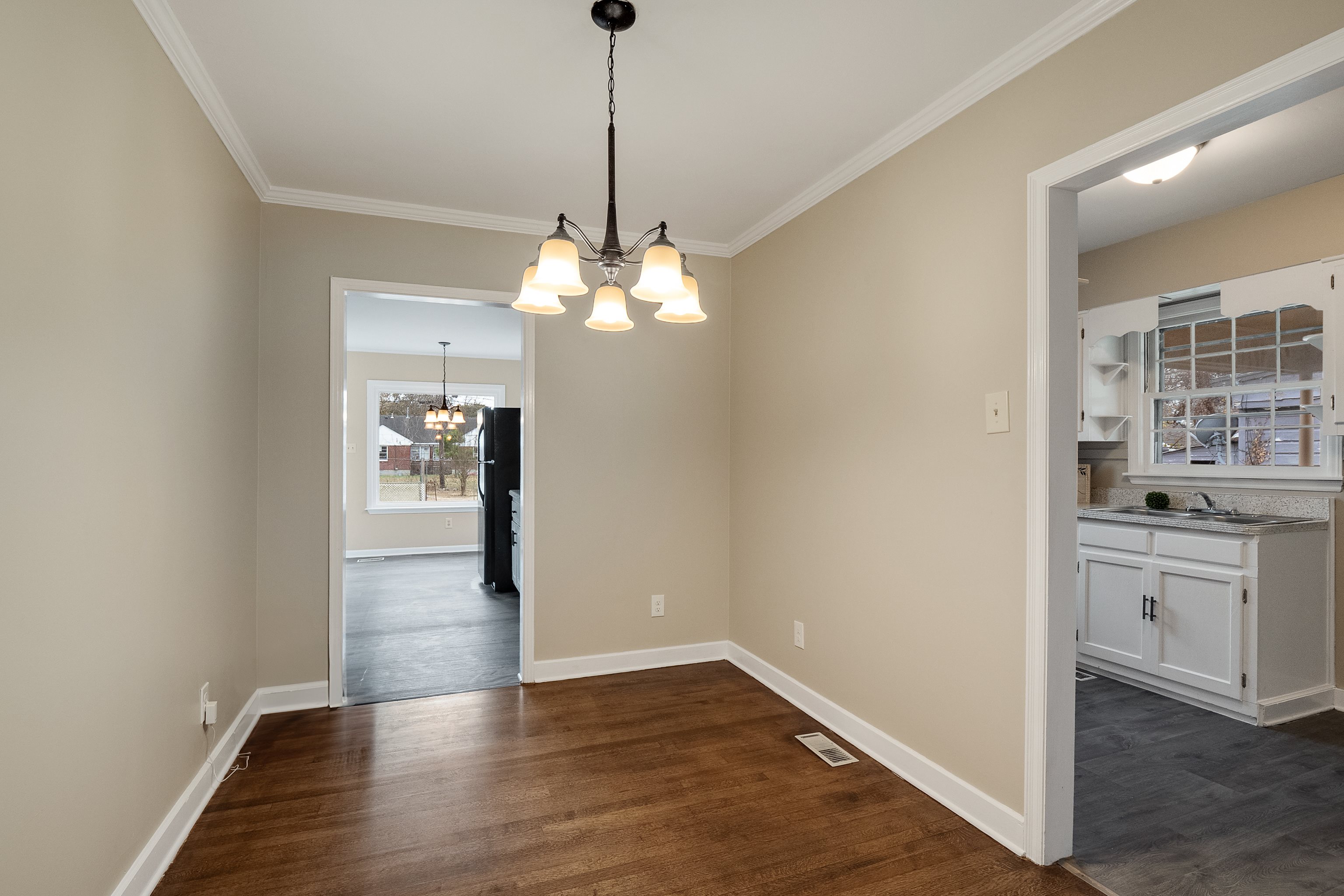 4329 Jamerson Road Memphis, TN 38122 - Photo 5 of 33 a view of a kitchen with a sink dishwasher and wooden floor