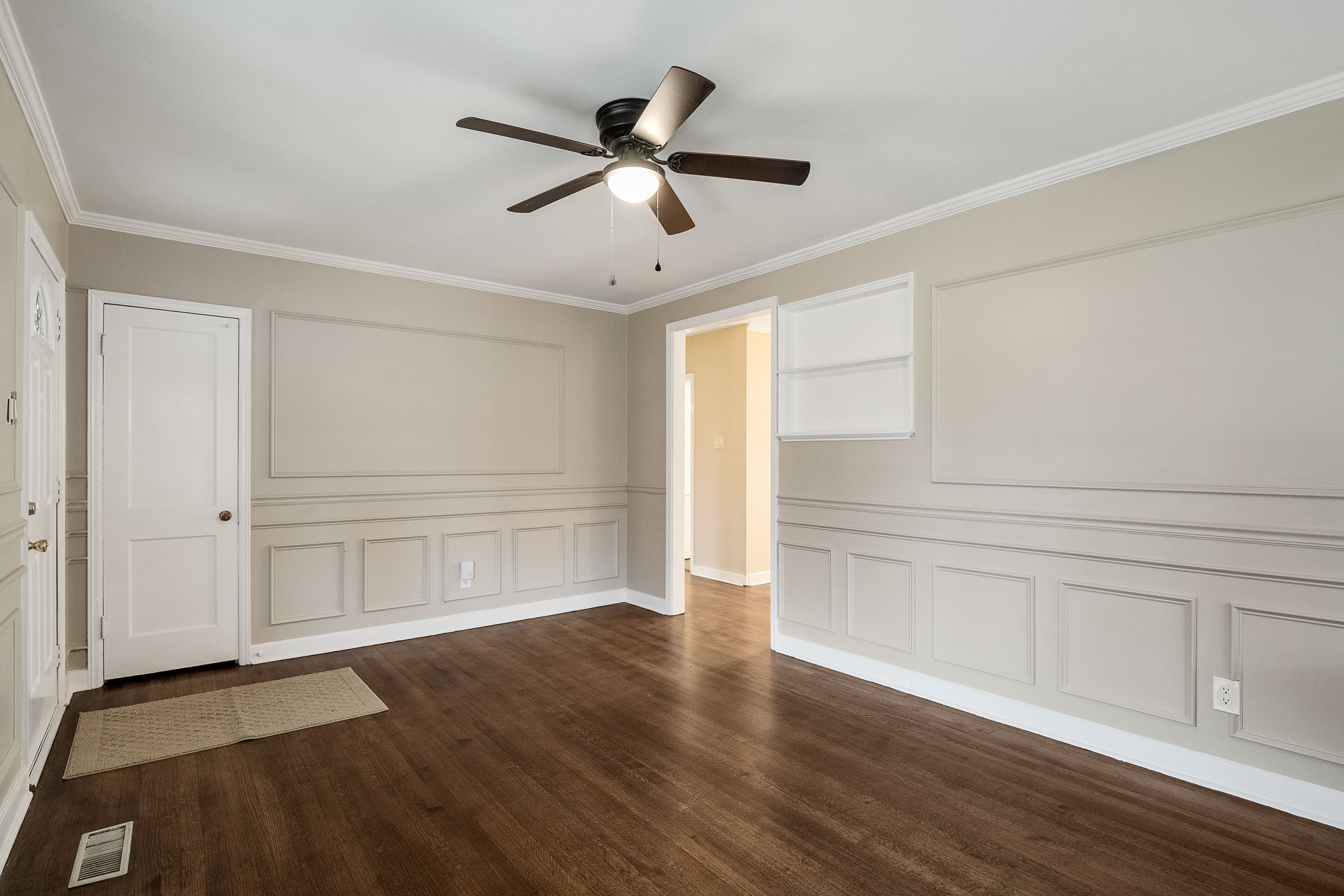 4329 Jamerson Road Memphis, TN 38122 - Photo 6 of 33 a view of an empty room with wooden floor and a window