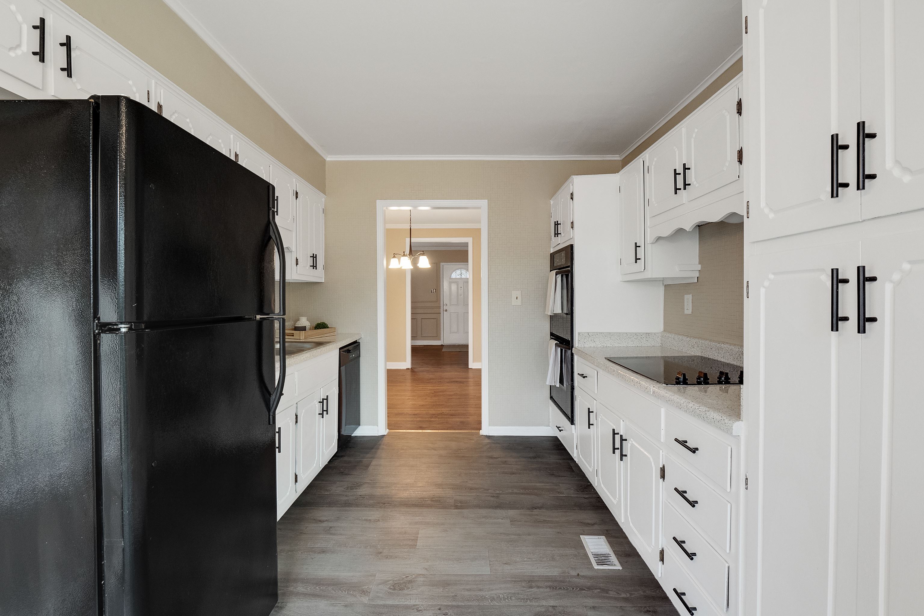 4329 Jamerson Road Memphis, TN 38122 - Photo 10 of 33 a view of hallway with wooden floor and cabinets
