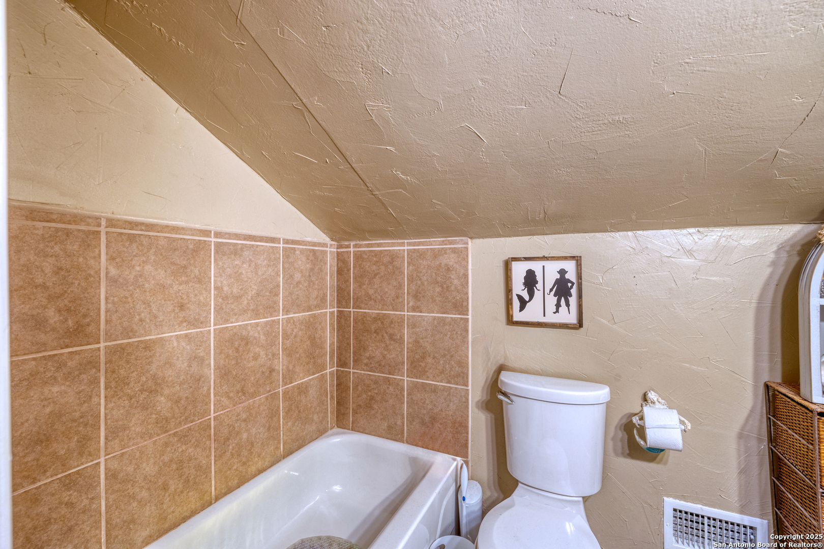 518 North Getty Street Uvalde, TX 78801 - Photo 18 of 31 a bathroom with a toilet and a shower