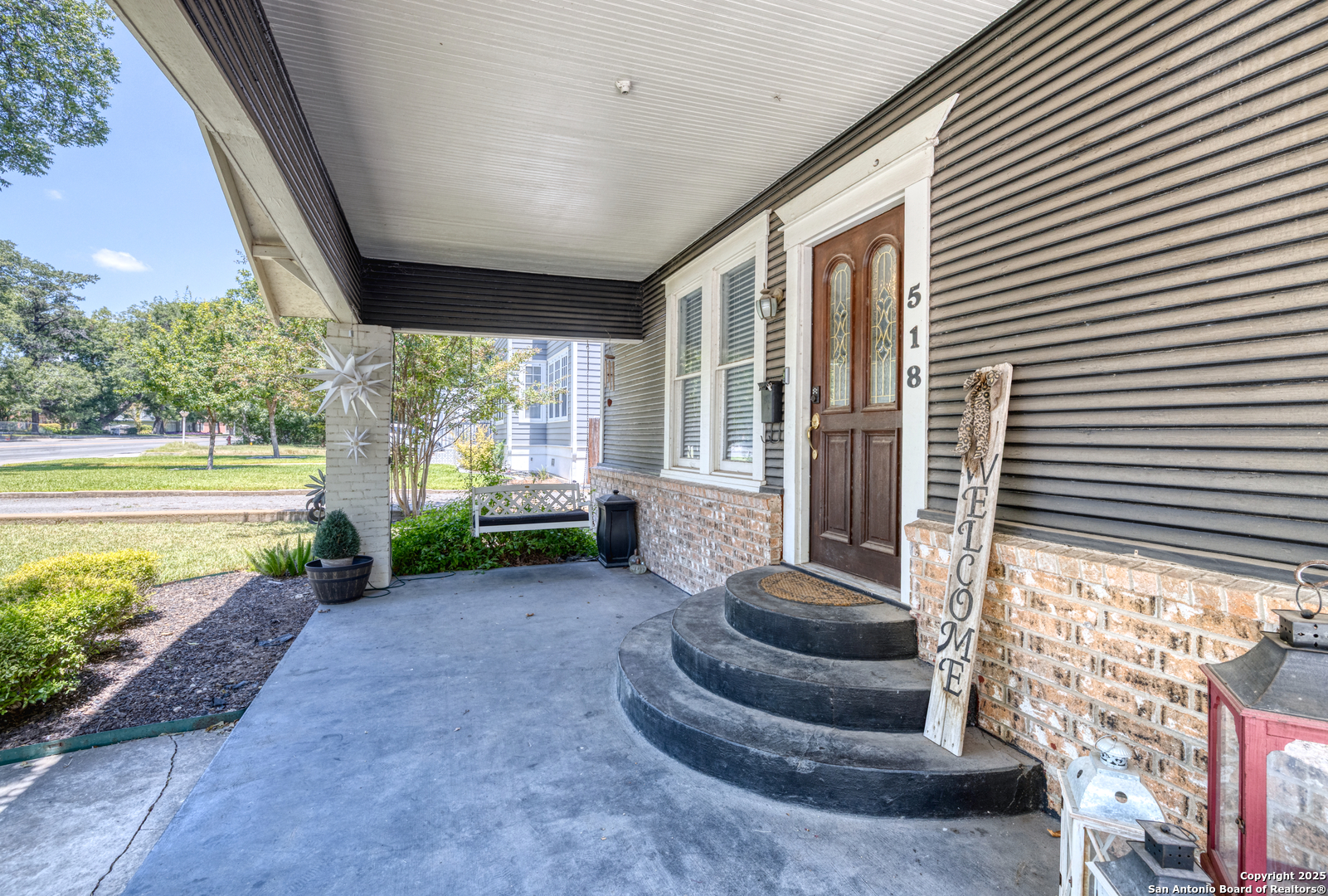 518 North Getty Street Uvalde, TX 78801 - Photo 21 of 31 a view of a porch with furniture and floor to ceiling window
