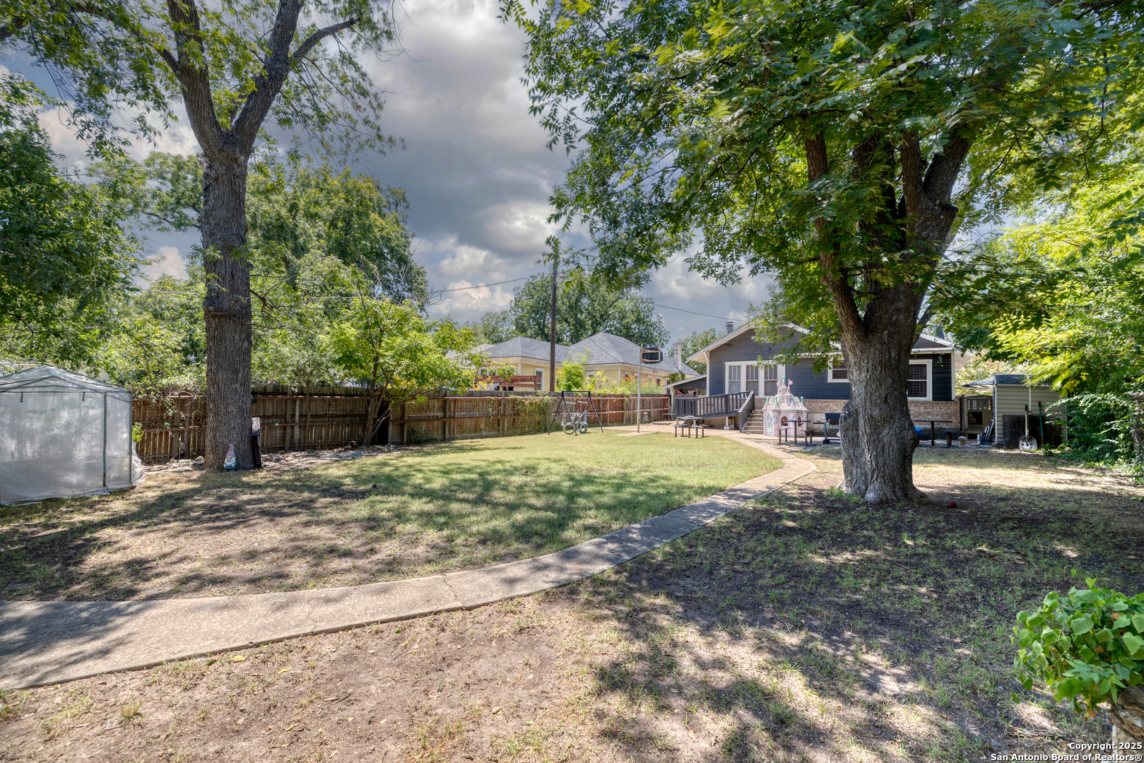 518 North Getty Street Uvalde, TX 78801 - Photo 23 of 31 a view of a yard with plants and trees