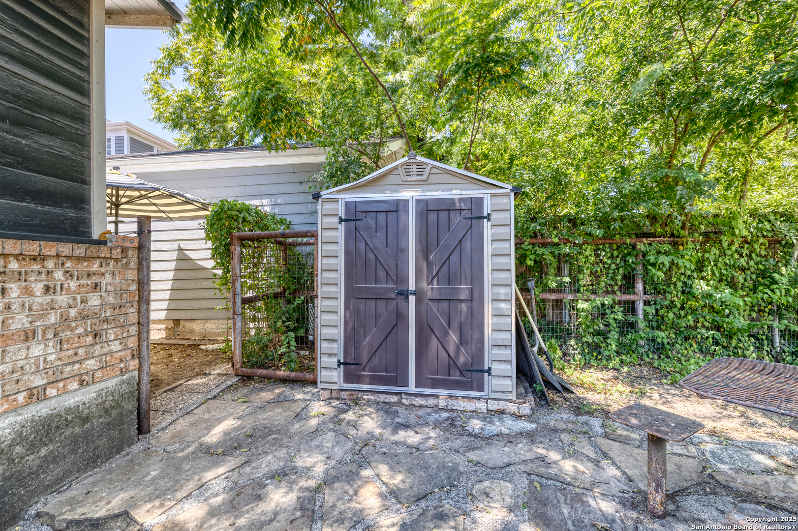 518 North Getty Street Uvalde, TX 78801 - Photo 24 of 31 a view of a small house with wooden fence