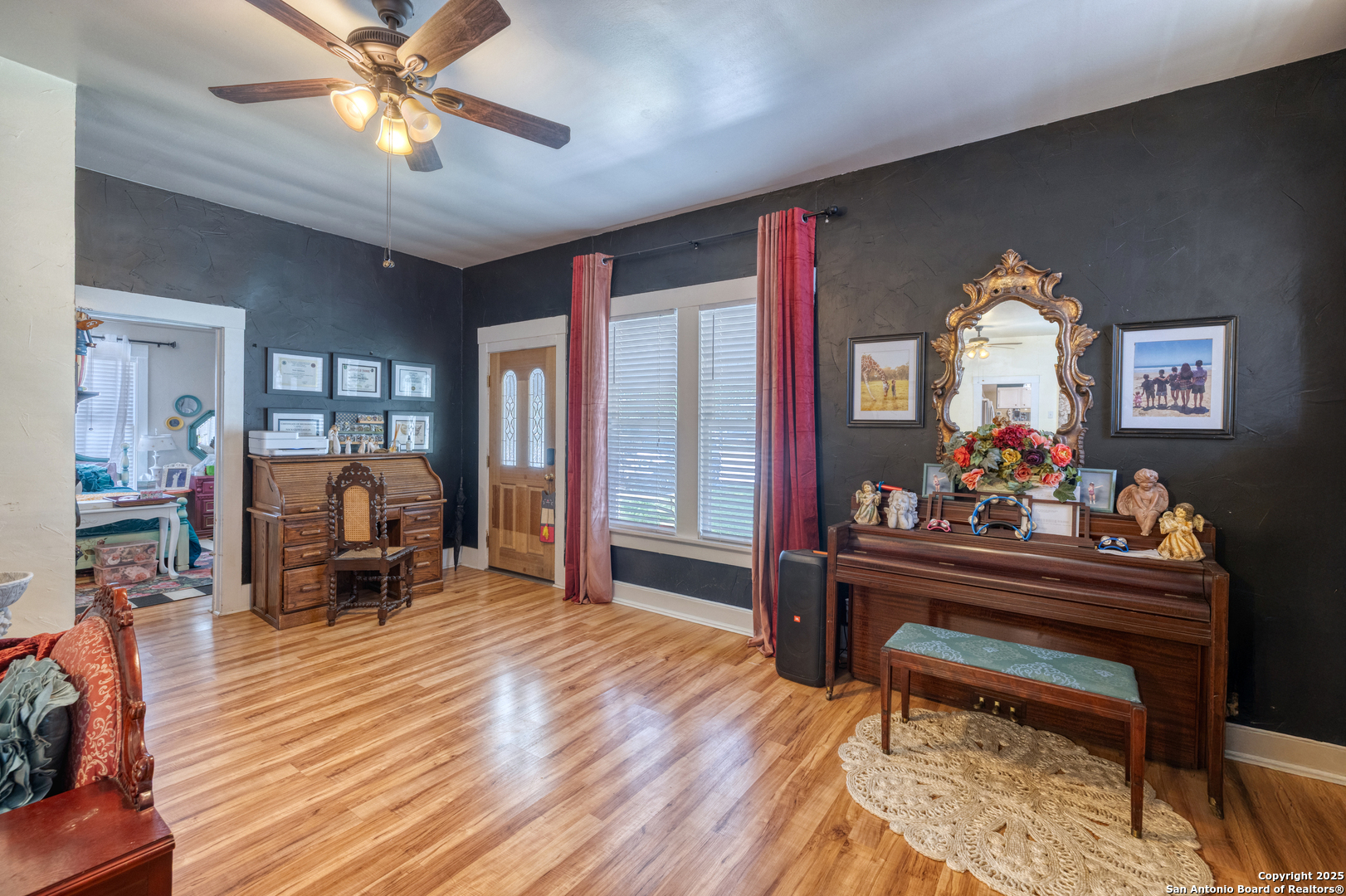 518 North Getty Street Uvalde, TX 78801 - Photo 8 of 31 a living room with furniture and a chandelier