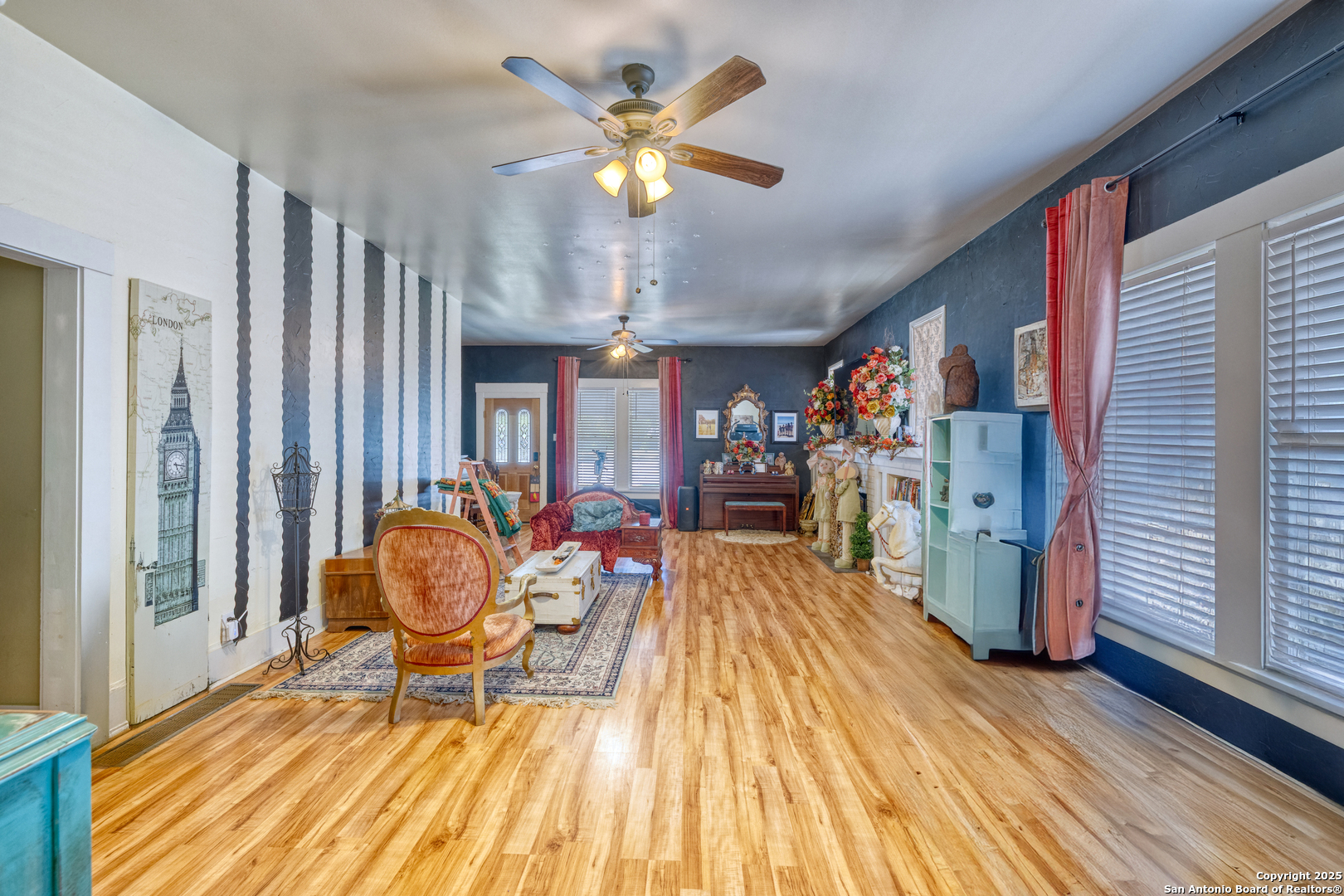 518 North Getty Street Uvalde, TX 78801 - Photo 9 of 31 a living room filled with furniture and a chandelier
