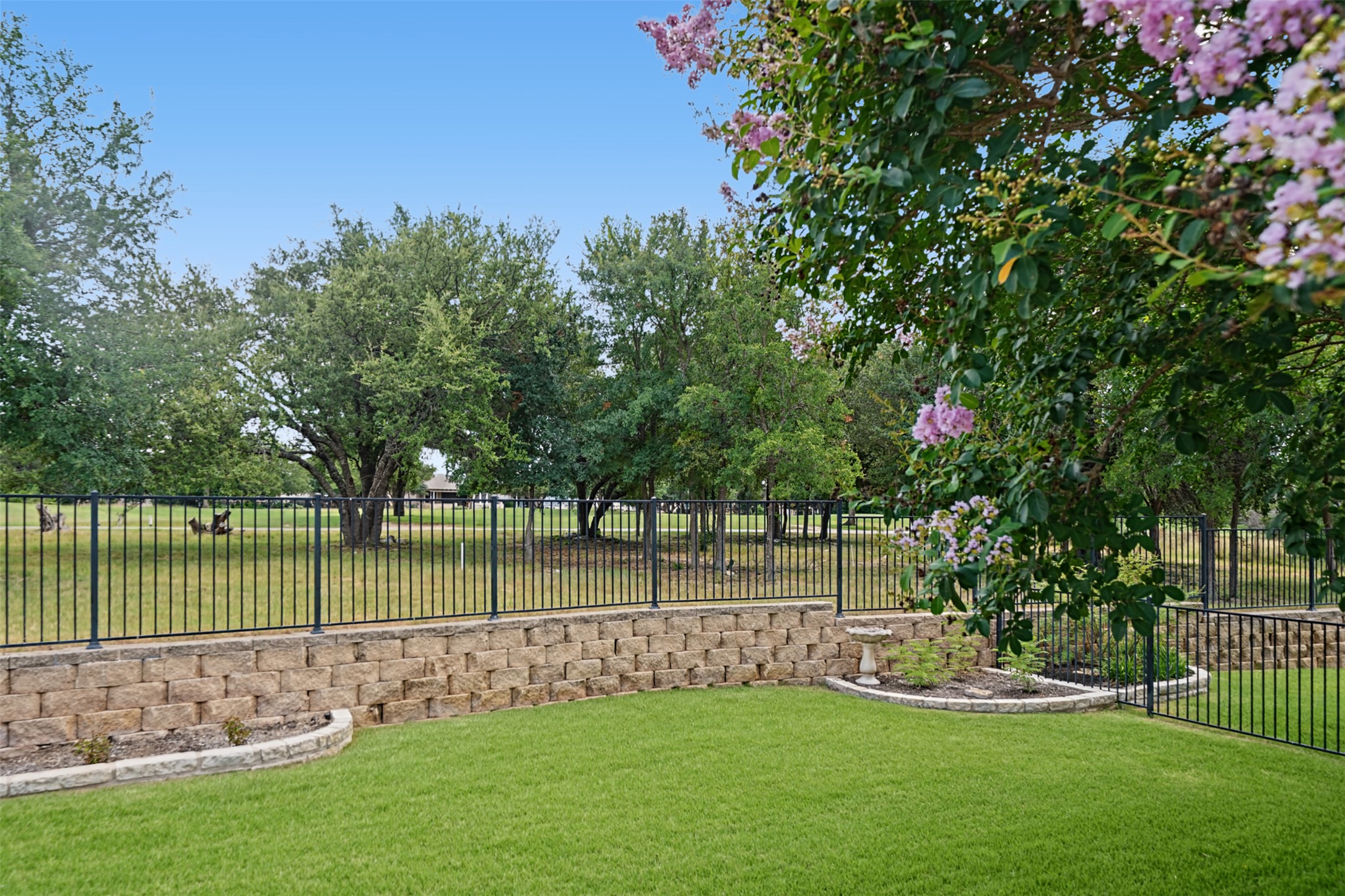 206 Mustang Is Trail Georgetown, TX 78633 - Photo 2 of 40 You can't quite see it in this photo, but the 4th hole green is just on the other side of those trees.