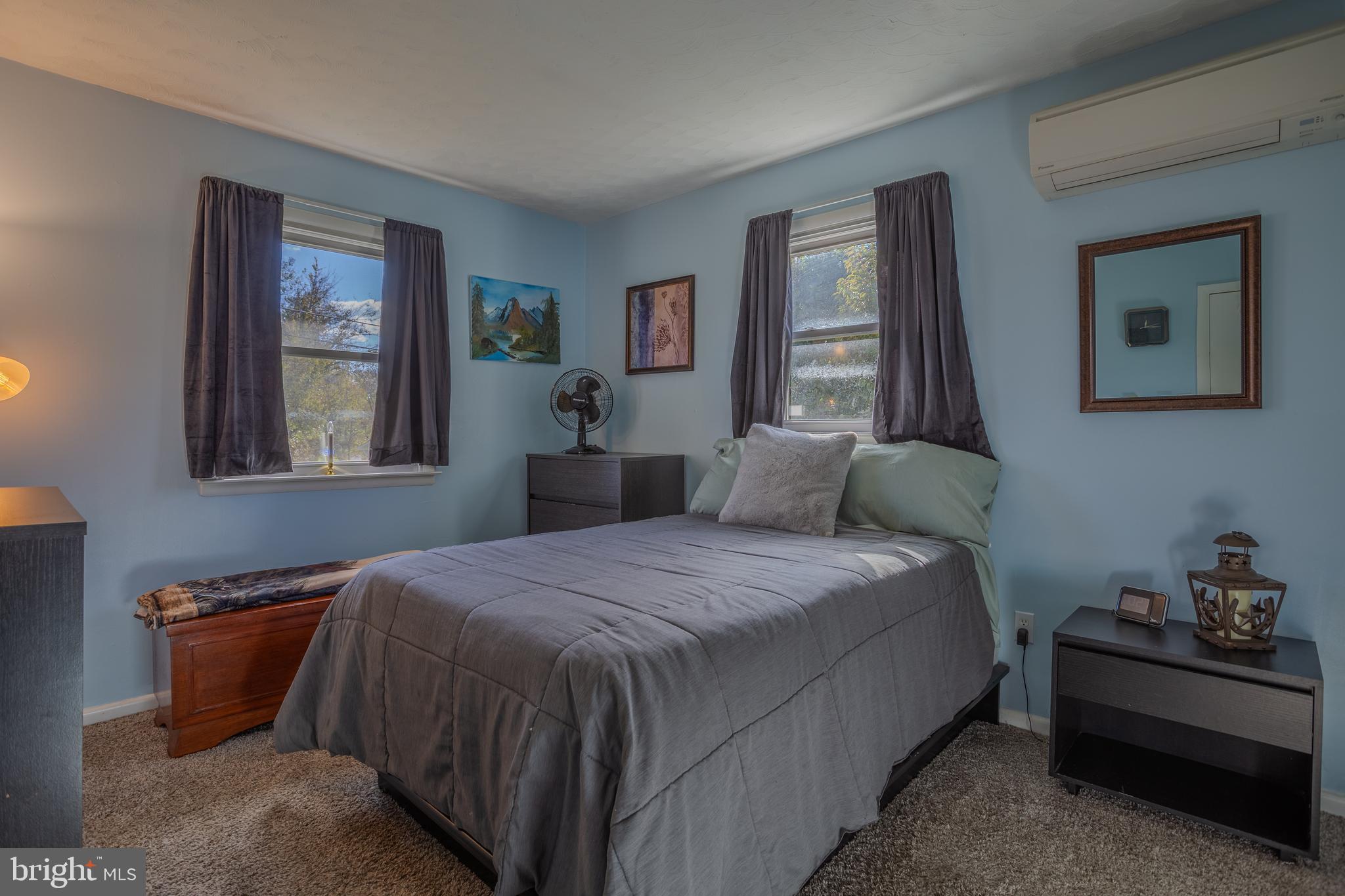 106 McDonald Street Ranson, WV 25438 - Photo 15 of 27 a bedroom with a bed and a window