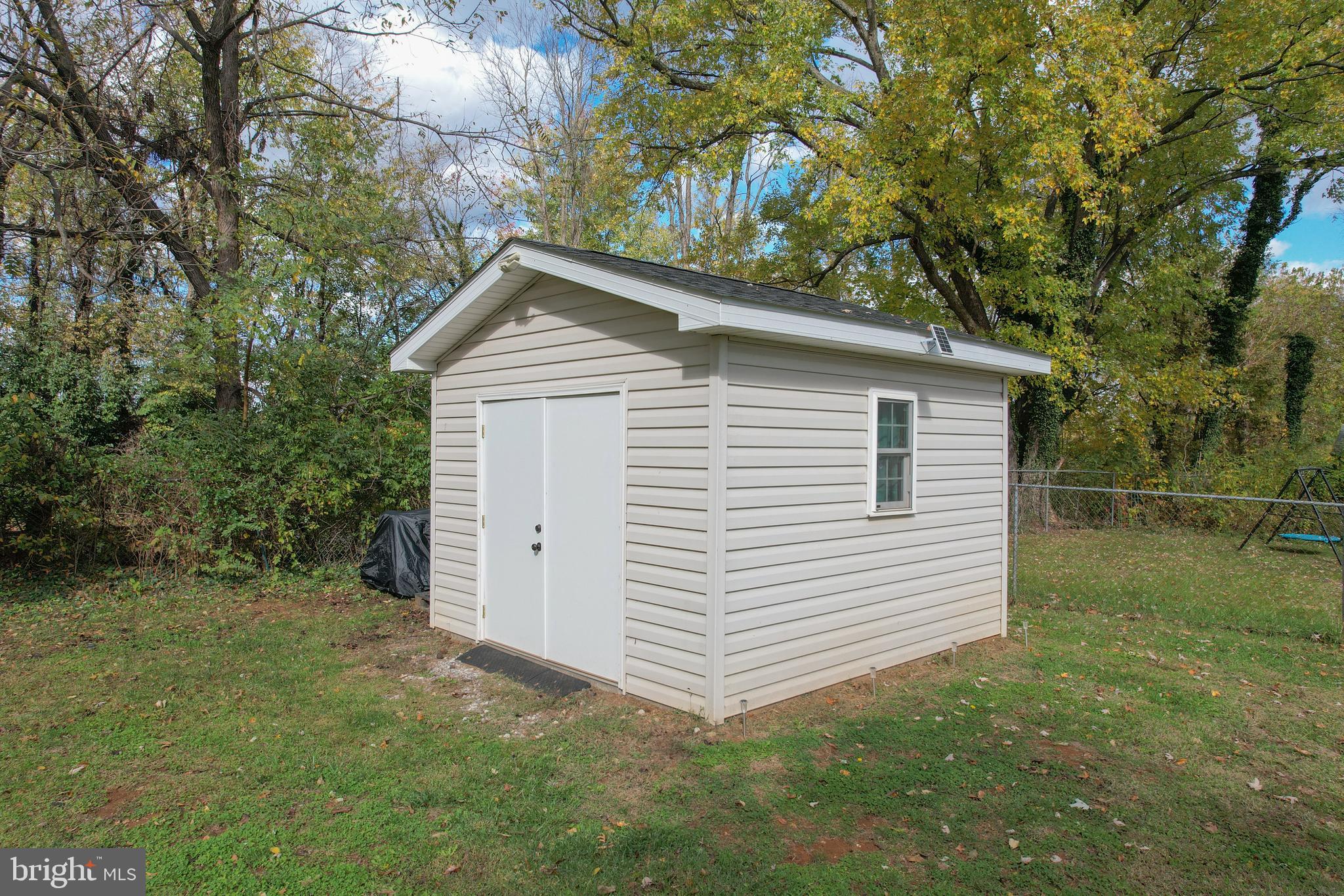 106 McDonald Street Ranson, WV 25438 - Photo 25 of 27 a view of a house with a yard