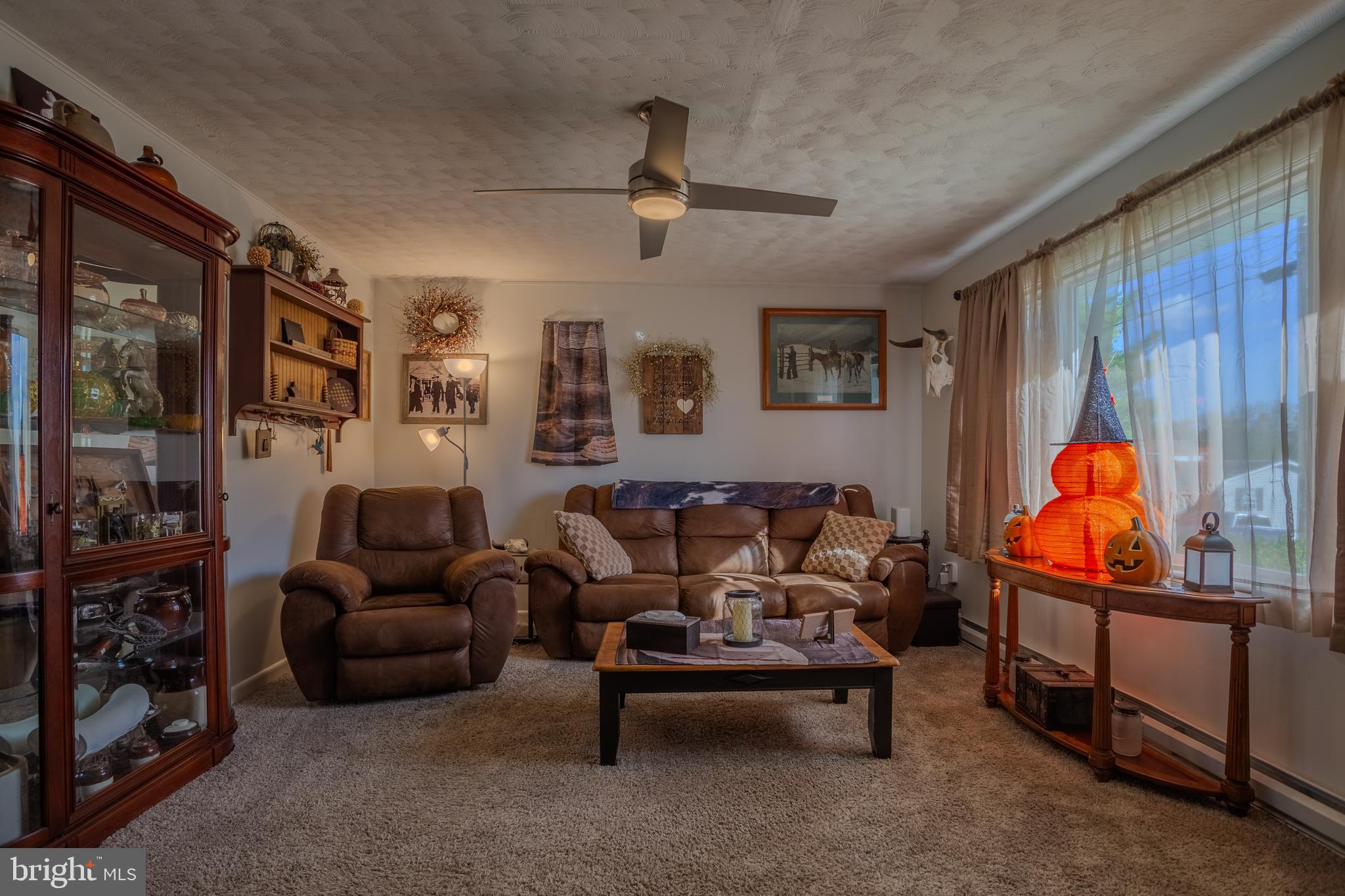 106 McDonald Street Ranson, WV 25438 - Photo 4 of 27 a living room with furniture a air conditioner vent and a window