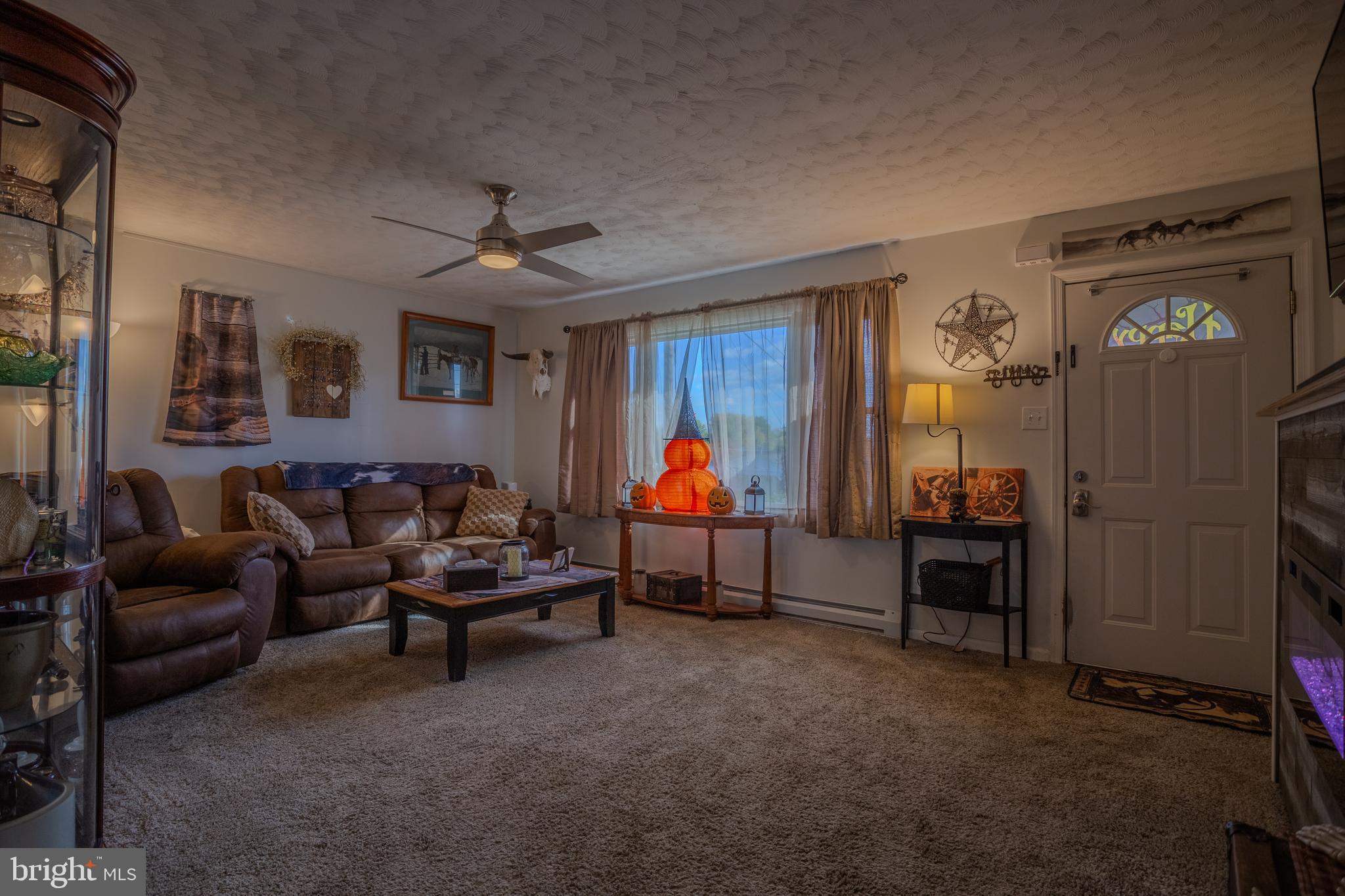 106 McDonald Street Ranson, WV 25438 - Photo 6 of 27 a living room with furniture and a window