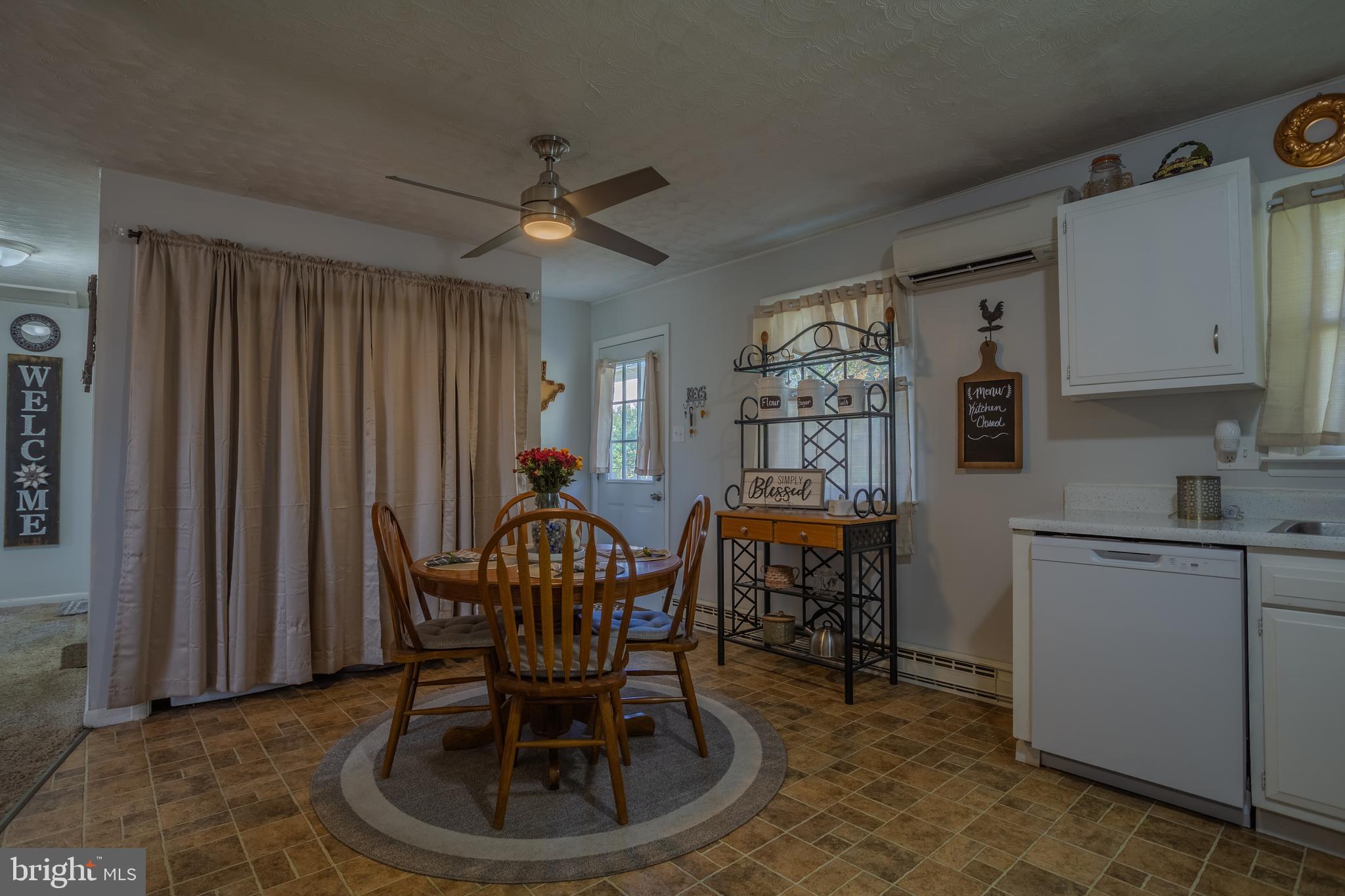 106 McDonald Street Ranson, WV 25438 - Photo 10 of 27 a dining room with furniture and window
