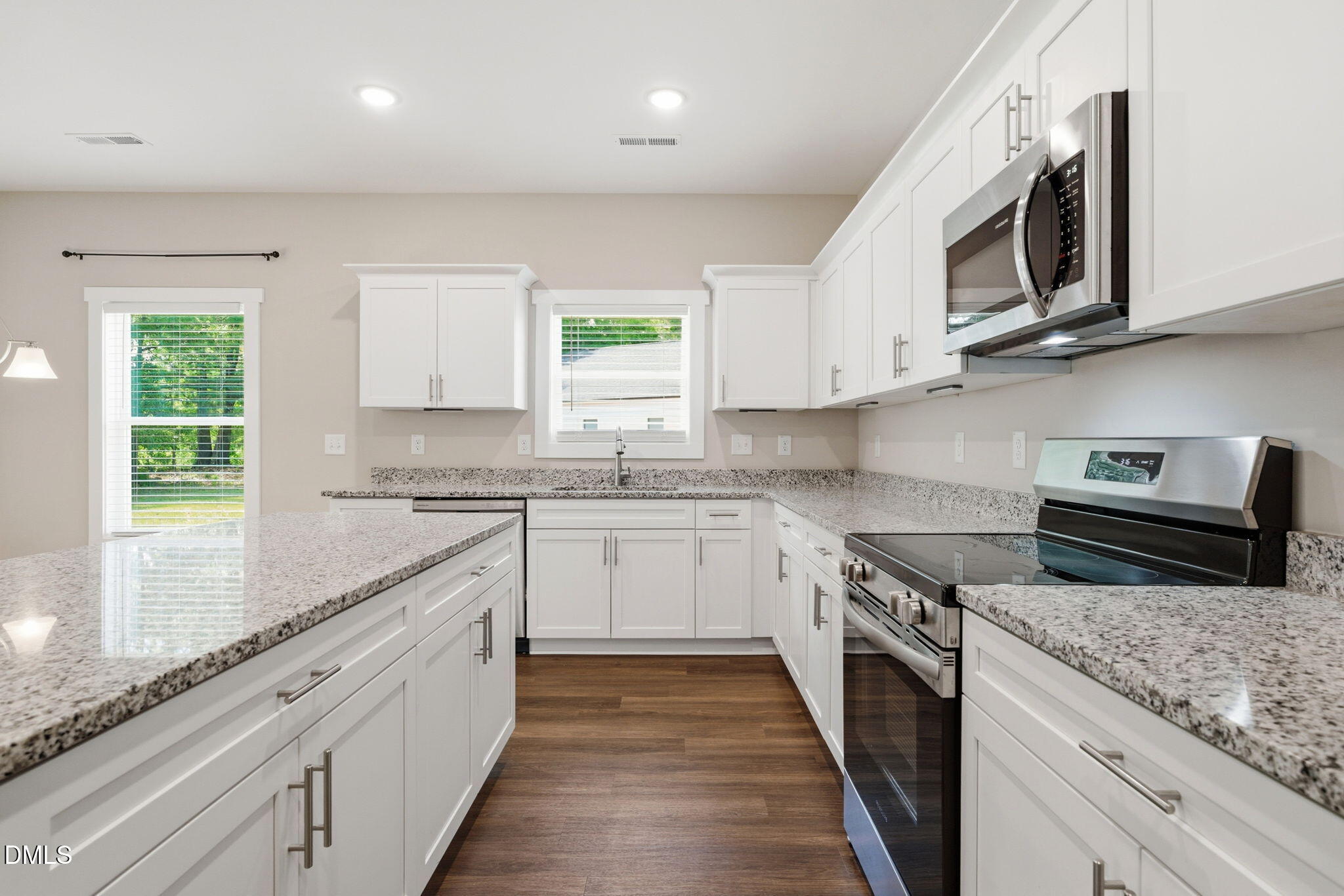 161 Tupelo Dr Spring Spring Hope, NC 27882 - Photo 9 of 28 a kitchen with stainless steel appliances granite countertop white cabinets granite counter tops and a window