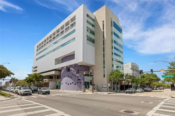 a view of a building with a street