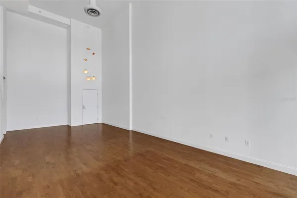 a kitchen with stainless steel appliances granite countertop a sink and a refrigerator