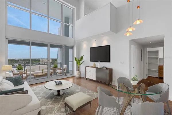 a view of an entryway with wooden floor