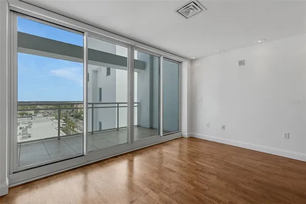 an empty room with glass door