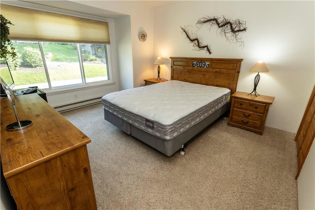 13 Lakeview Road Hidden Valley, PA 15502 - Photo 12 of 33 a bedroom with a bed and window