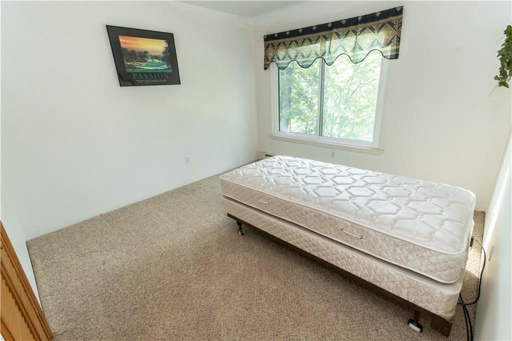13 Lakeview Road Hidden Valley, PA 15502 - Photo 15 of 33 a bedroom with a bed and a window