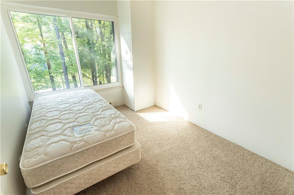 13 Lakeview Road Hidden Valley, PA 15502 - Photo 16 of 33 a bed sitting in a bedroom next to a window