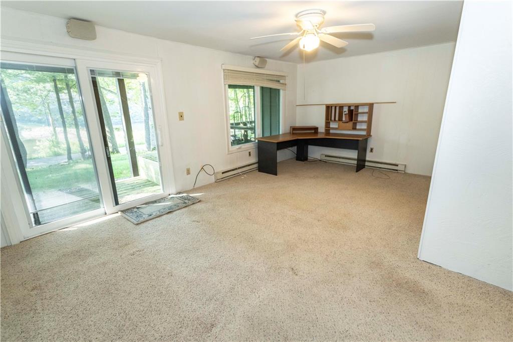 13 Lakeview Road Hidden Valley, PA 15502 - Photo 17 of 33 an empty room with windows and fan