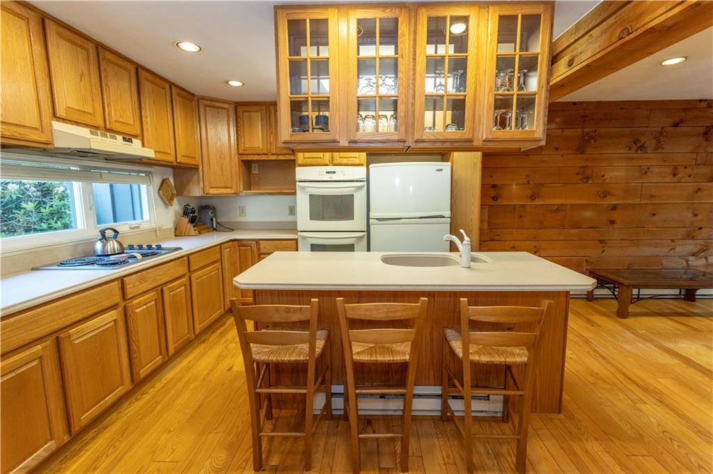 13 Lakeview Road Hidden Valley, PA 15502 - Photo 10 of 33 a kitchen with stainless steel appliances granite countertop a sink and wooden cabinets