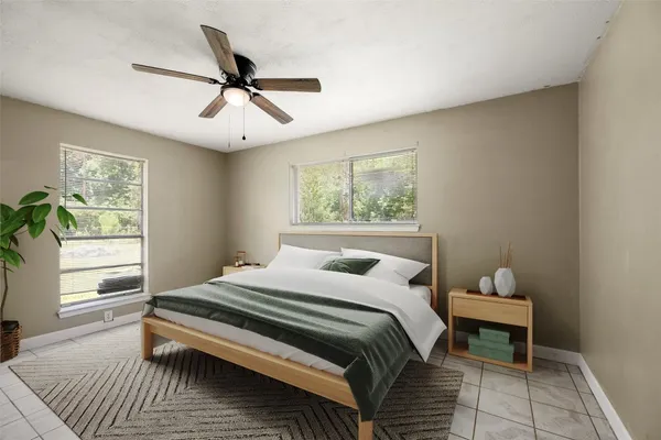 a bedroom with a bed and a window