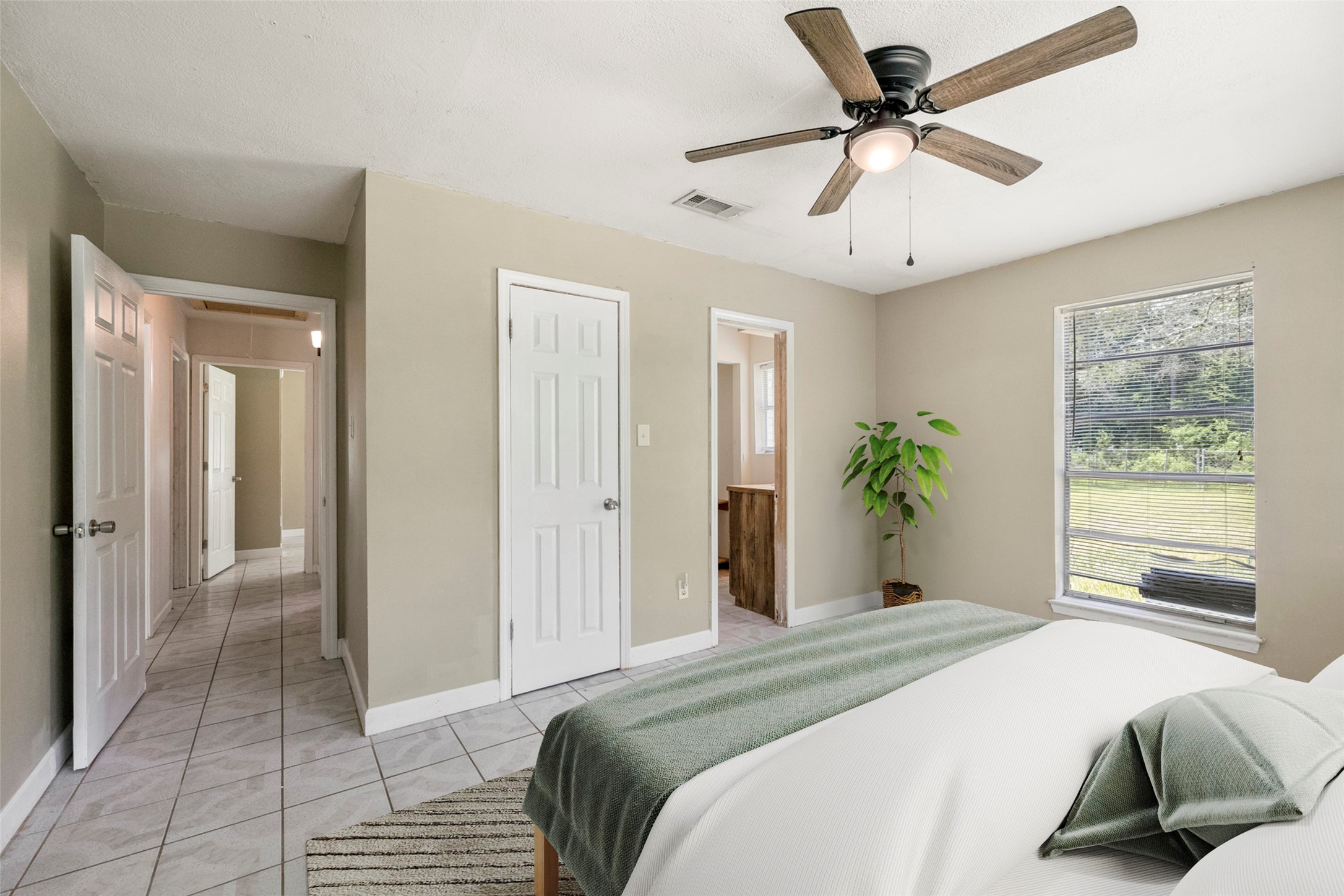 140 Friar Tuck Road Shepherd, TX 77371 - Photo 14 of 36 a bedroom with a bed and a window