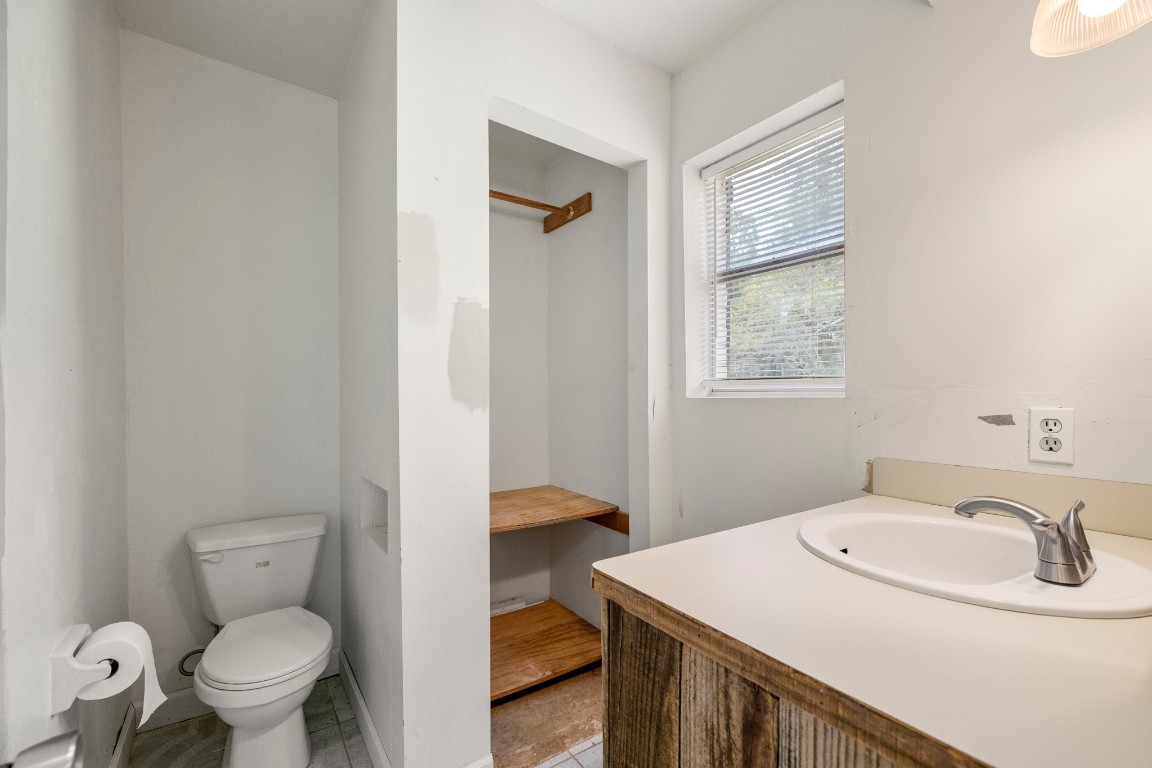140 Friar Tuck Road Shepherd, TX 77371 - Photo 15 of 36 a bathroom with a sink toilet and vanity